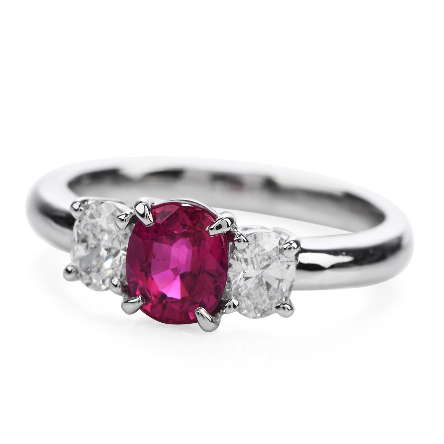 Witness the Delicate touch of color and sparkle on this Engagement Ring!

This elegant Three Stone Style piece is Crafted in Solid Platinum,

weights 5.6 grams and the top measures  12 mm x 6 mm, 5 mm high.

Bringing amazing Bright Red Color there