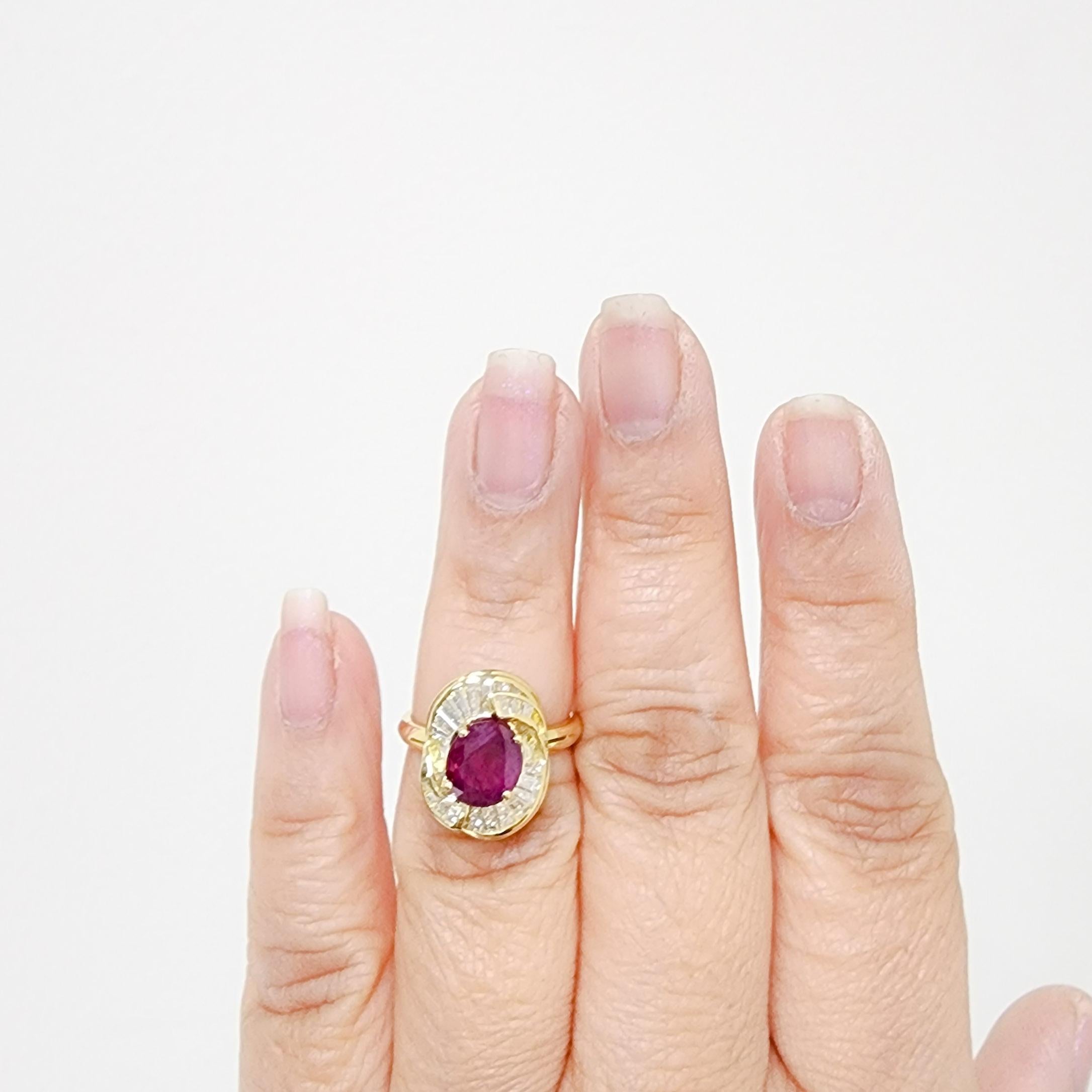Beautiful 2.81 ct. Burma red ruby oval with 1.00 ct. of good quality white diamond baguettes.  Handmade in 18k yellow gold.  Ring size 6.25.  GIA certificate included.