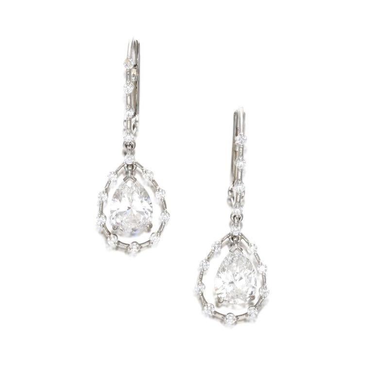 Intricate design, each composed of a pear-shaped diamond, suspended within a diamond wire.
- Pear-shaped diamonds weighing a total of 2.58 carats
- Round diamonds weighing a total of approximately 0.45 carat
  Platinum.
- Total weight 6.00 grams
-