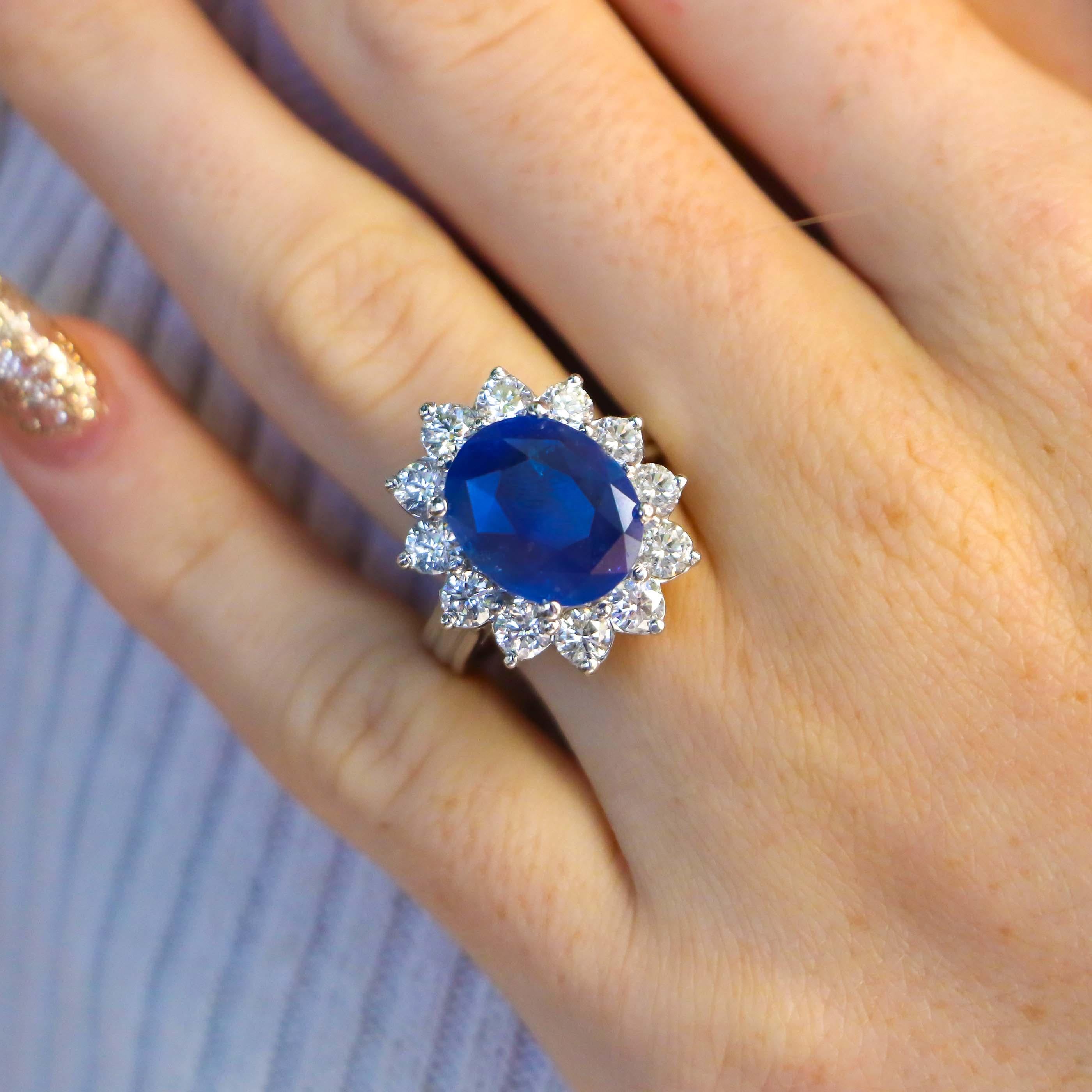 Mesmerizing large GIA Certified Blue Ceylon Sapphire Ring with a halo of round diamonds. This beautiful cocktail sapphire ring is a great accent of sophistication. It would be a great engagement ring for a sapphire lover! The outside circle of