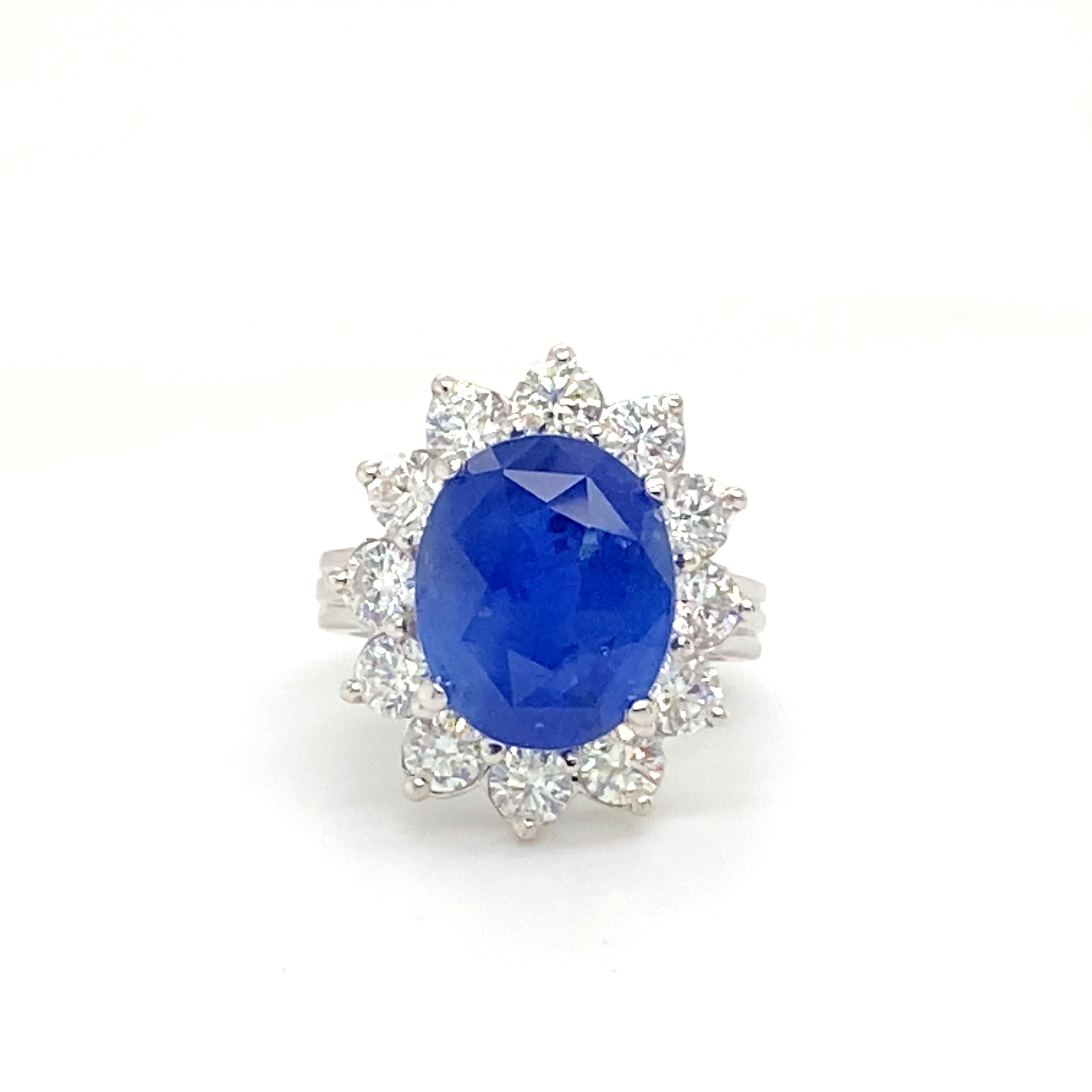 Women's GIA Cerified 8.79 Carat Oval Ceylon Sapphire Ring Set with Diamonds For Sale