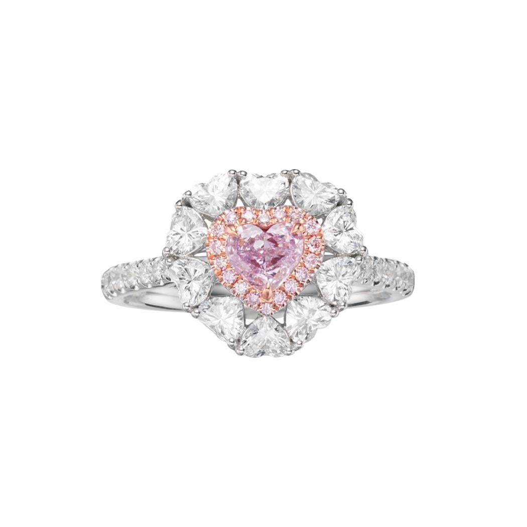 Introducing an exquisite 18k White Gold Heart-Shaped Diamond Ring that epitomizes luxury and elegance. This stunning piece features a center stone with a Fancy Light Pinkish Purple color grade (GIA NO. 6435628890), weighing 0.27 carats. The center