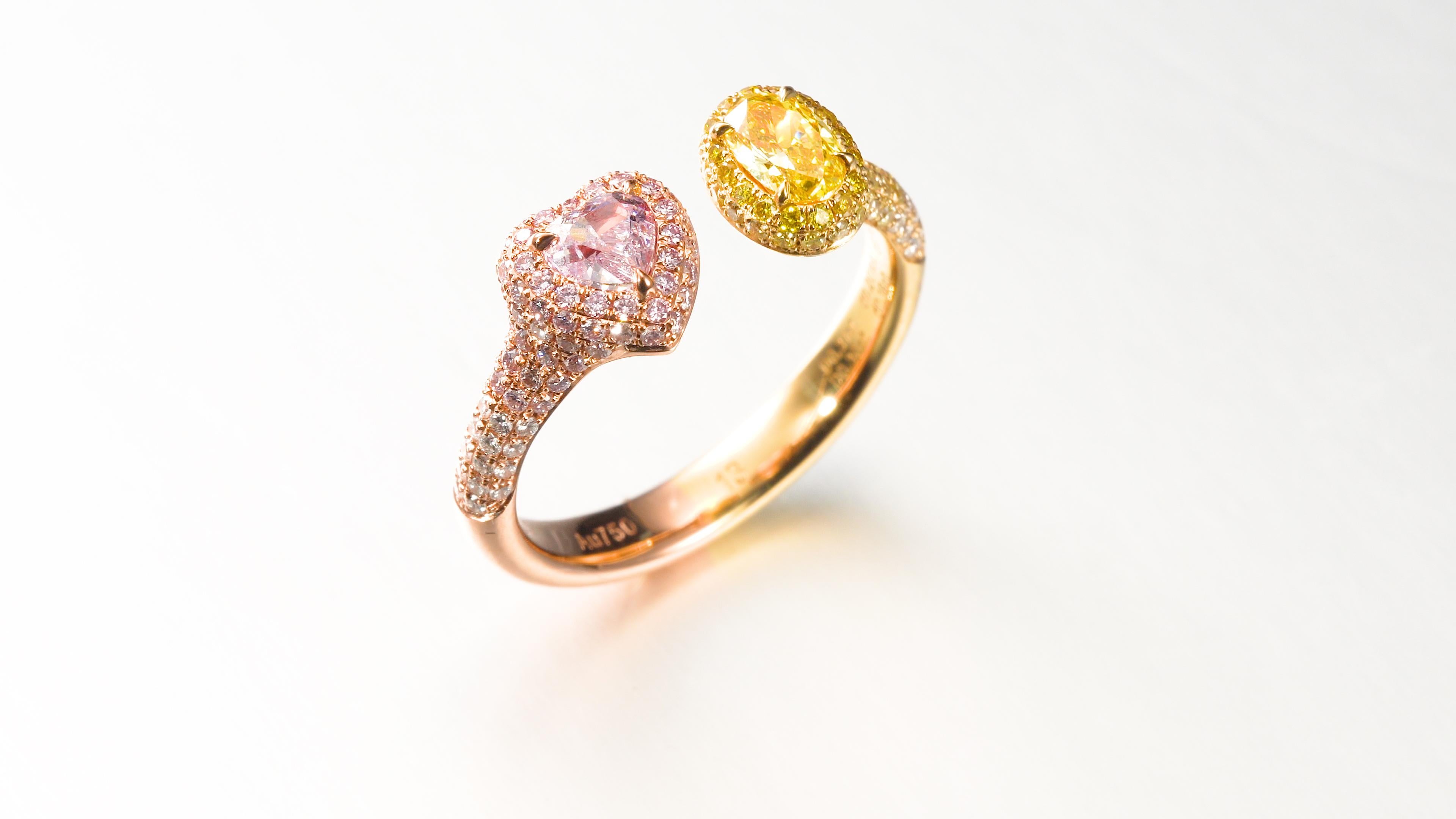Contemporary GIA Cert 0.61ct Fancy intense Yellow and Fancy Light Purplish Pink Diamond Ring For Sale
