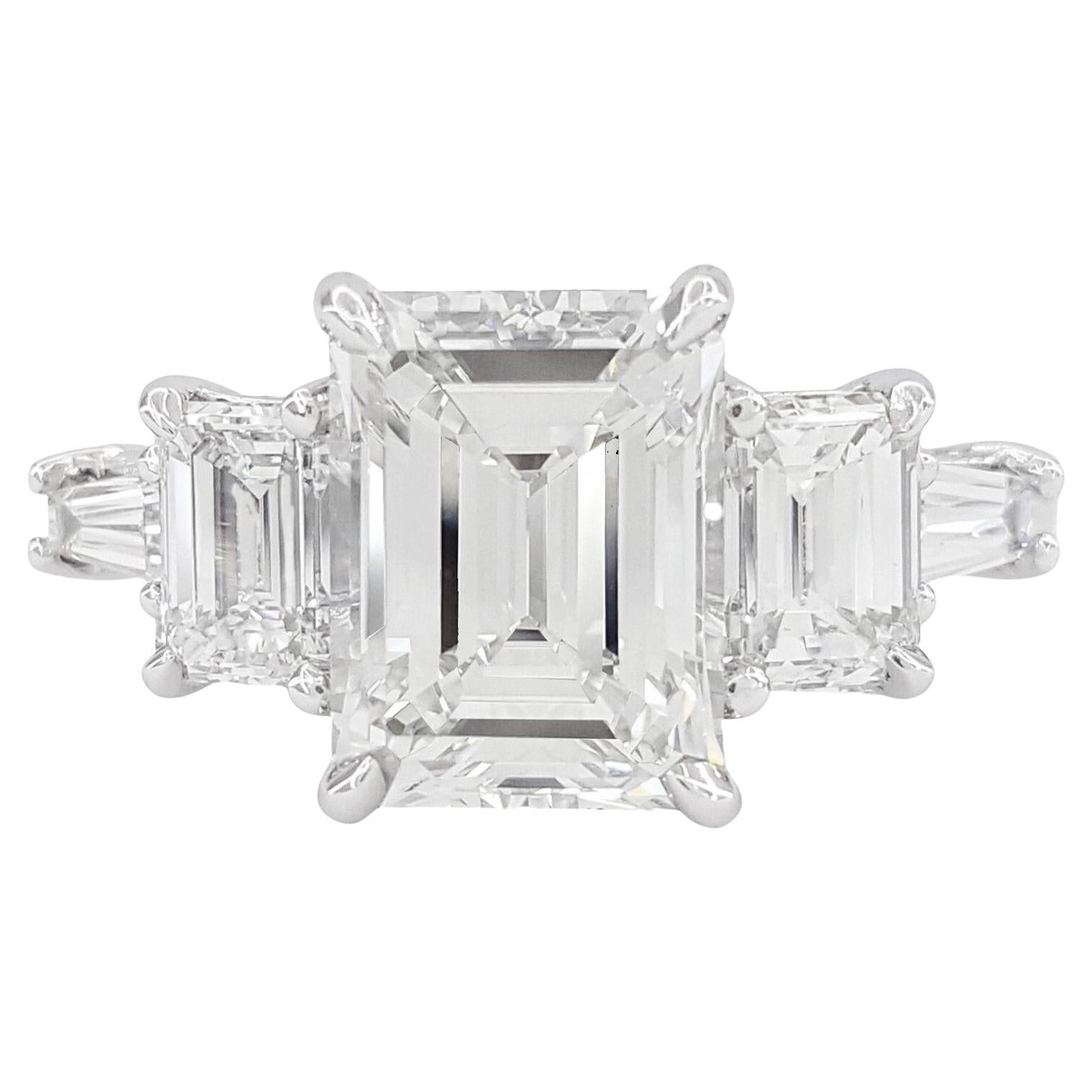 GIA Cert. 4 Ct F Color VS Emerald Cut Diamond Three stones 18K White Gold Ring For Sale