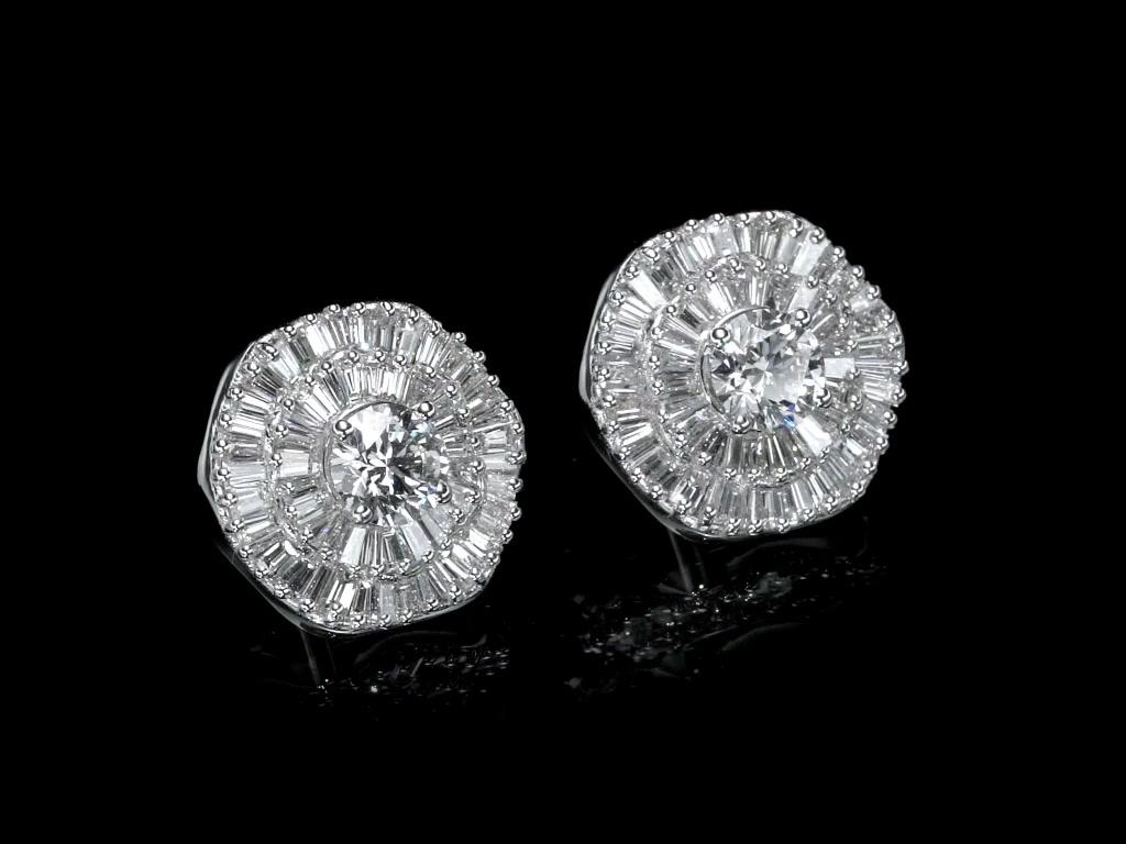 Interchangeable Double Halo Ballerina style pair of diamond earrings 4.66 Carat total diamond weight. 
One of a kind earrings are made with detailed craftsmanship and are set with two high quality GIA certified diamonds: E / VVS  & E / VS1 .  
Our