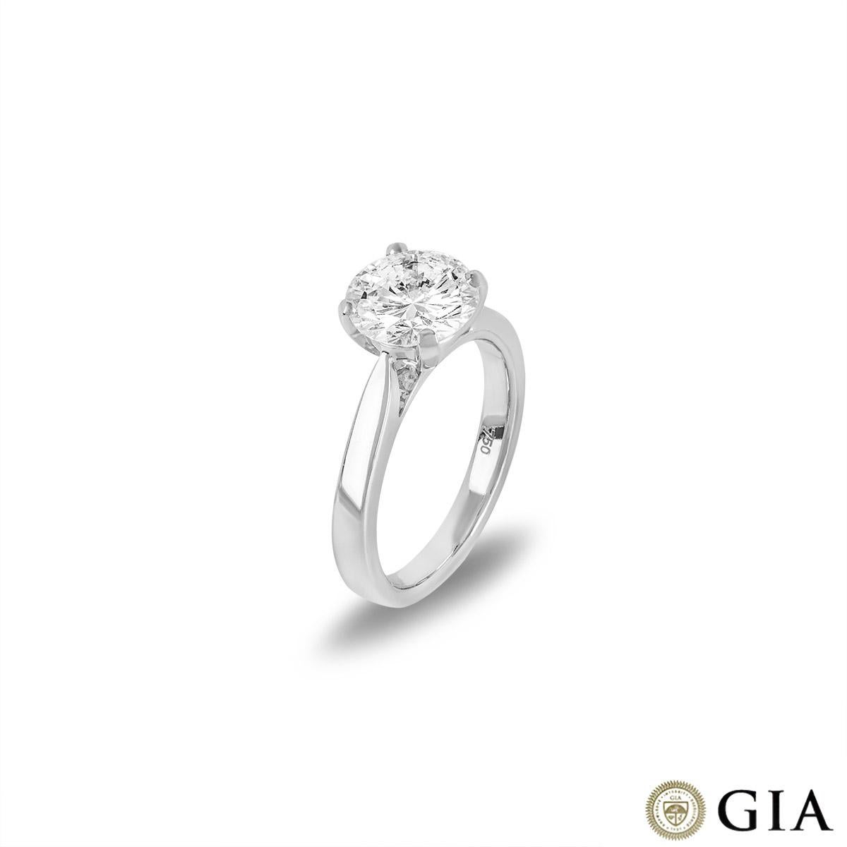 A beautiful 18k white gold diamond engagement ring. The central round brilliant cut diamond weighs 2.08ct, is E colour and VVS2 in clarity. The ring is currently a size UK M½/US 6.25/EU 53 but can be adjusted for a perfect fit. The ring has a gross