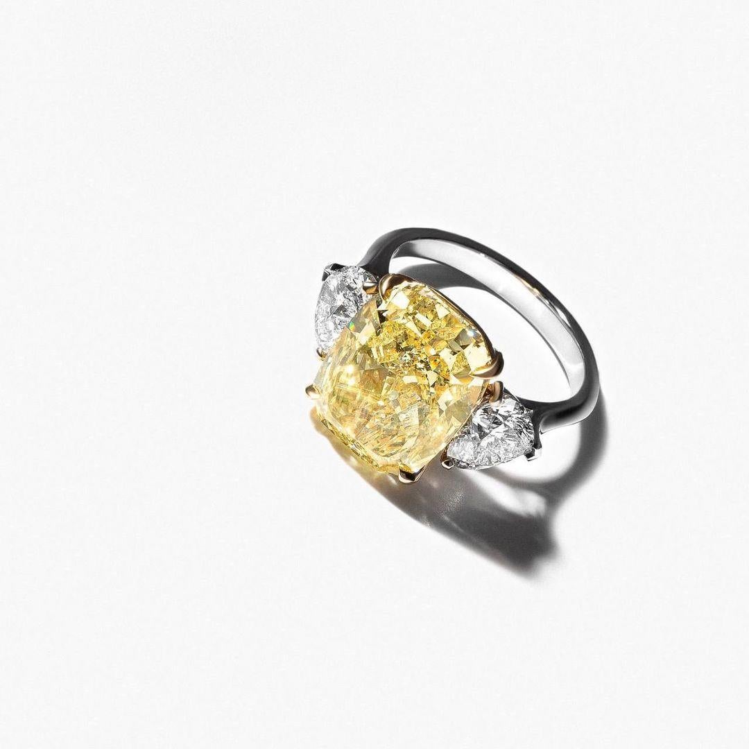 Contemporary GIA Certied 5.52 Carat Fancy Yellow Elongated Cushion Cut Diamond Ring For Sale