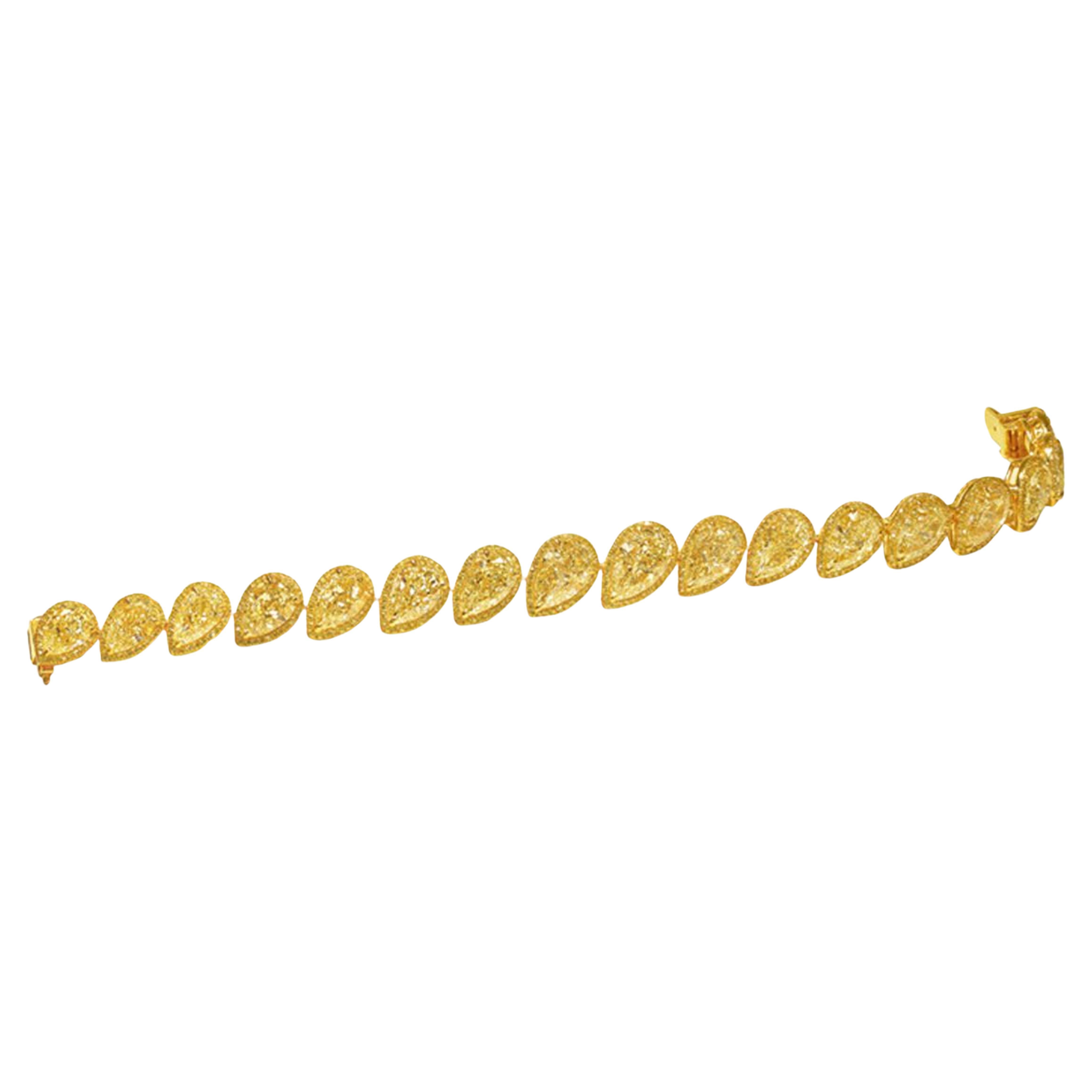 a truly spectacular adornment for the wrist - the 35 carat Pear Shape Yellow Diamond Bracelet, certified by GIA, promises to captivate with its unparalleled beauty and sophistication.

This immaculate bracelet features a stunning collection of 17