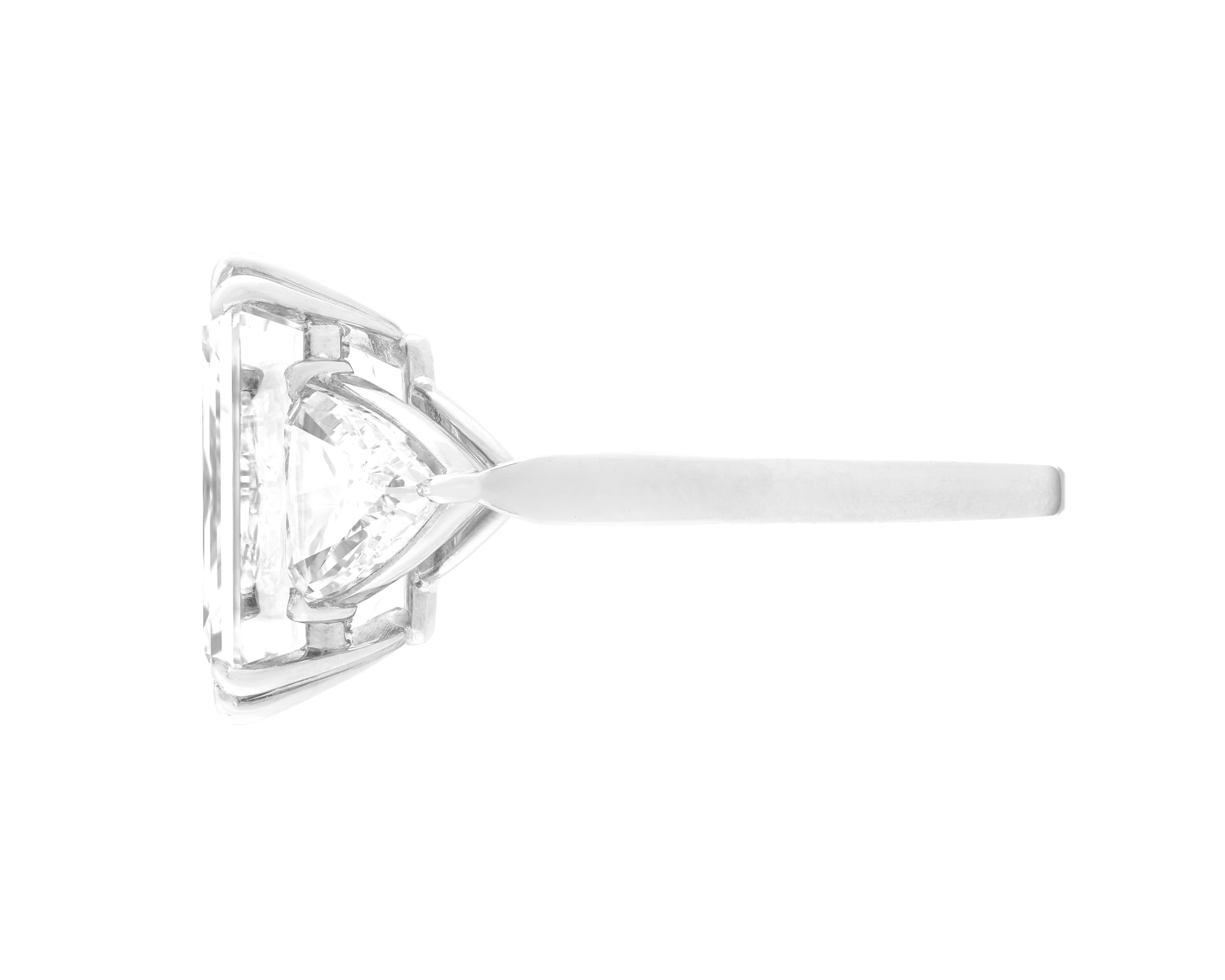 A timeless and refined creation, this GIA Certified 5.03 carat Emerald Cut Diamond ring is a true statement of elegance and rarity. Expertly set in platinum, the ring showcases a magnificent center stone with exceptional proportions and