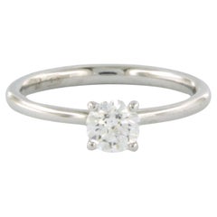 GIA certificate. - 18k gold solitaire ring with diamond