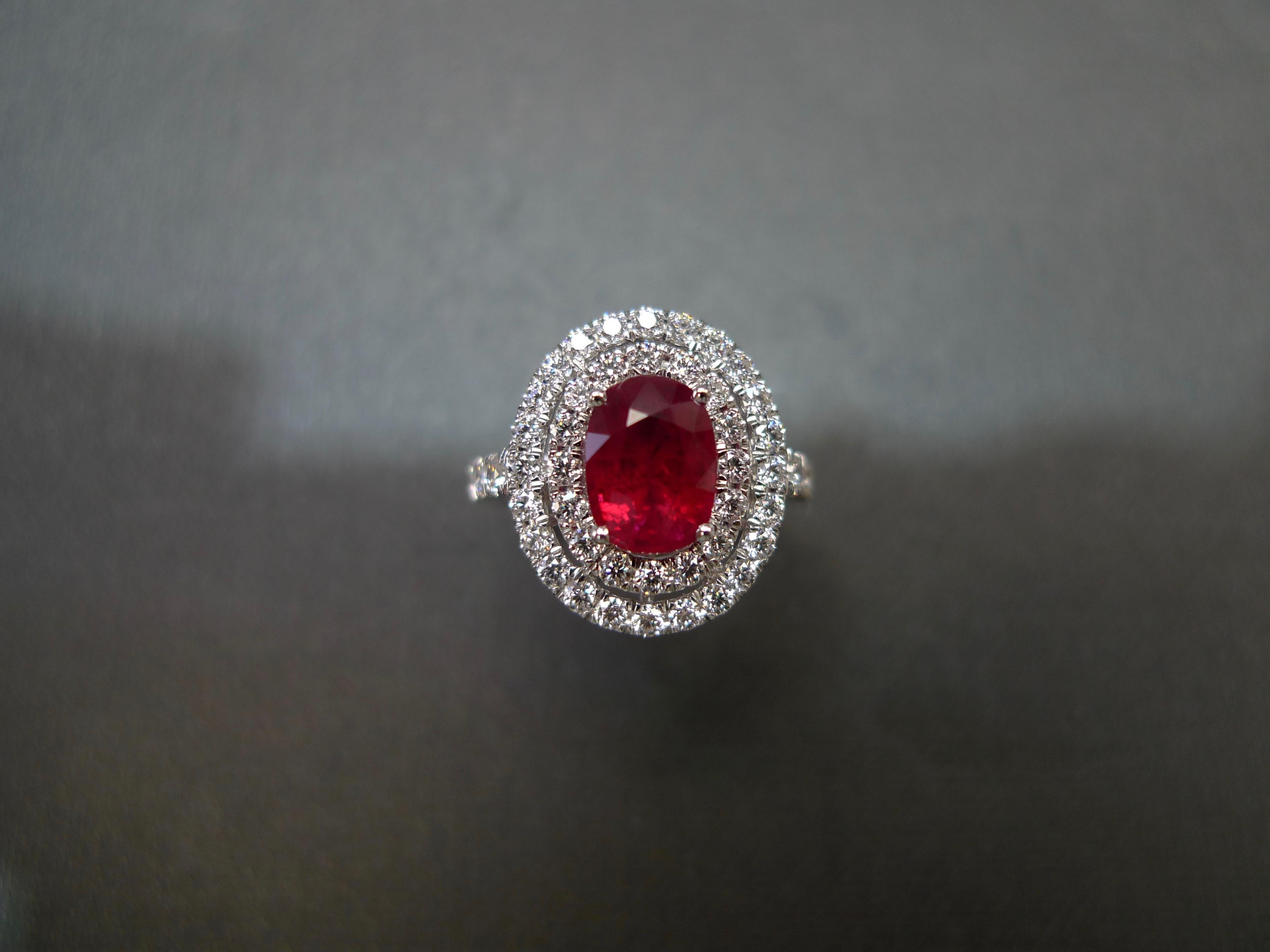 A stunning ruby diamond ring set with a 2.03ct natural ruby at the centre and round brilliant cut diamond on the side. 

Product Specifications:
Center Stone: High quality natural Burma oval shape ruby 
Weight: 2.03ct (8.14 x 5.99 x 4.55 mm) 
Color: