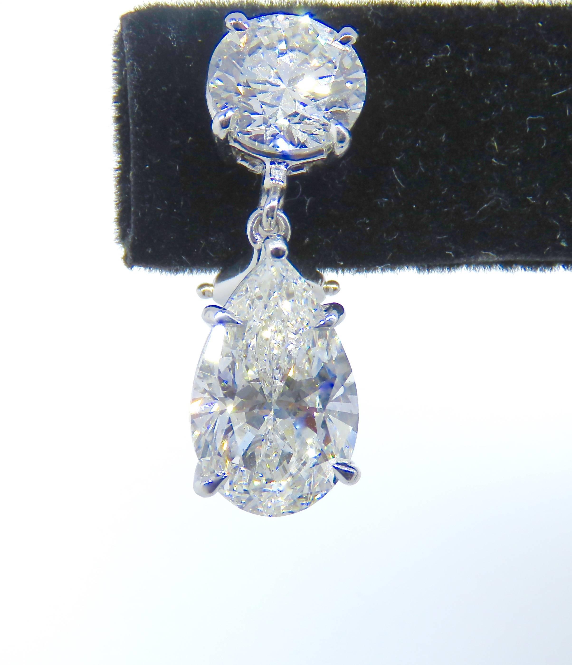 Estate GIA Certified Platinum Diamond Round and Pear Shaped Earrings In Excellent Condition In New York, NY