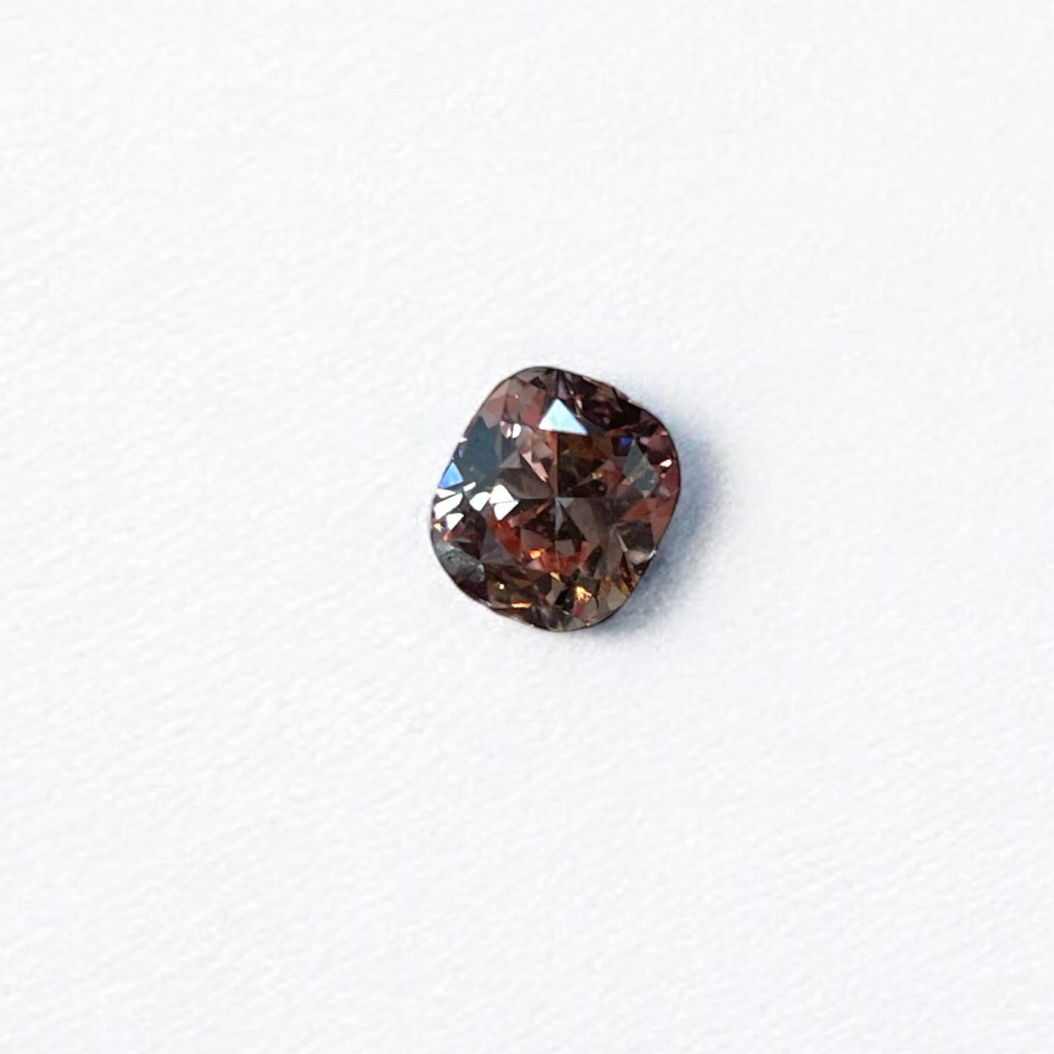 ITEM DESCRIPTION

ID #: NYC58602
Stone Shape: Cushion
Diamond Weight: 0.11ctw
Fancy Color: Fancy brownish orangy pink
Cut: Modified Brilliant
Measurements: 2.98 x 2.68 x 1.92 mm
Symmetry: Good
Polish: Good
Fluorescence: None
Certifying Lab: GIA
GIA