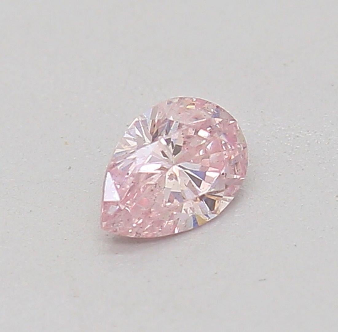 Certificate: GIA
Report Number:  2225431994
Shape And Cut: pear
Carat Weight: 0.13 carat
Measurements:  4.04 x 2.93 x 1.86 mm
Color Grade: Fancy Light Pink

FEATURES OF THE DIAMOND:

Our pear-shaped diamond, also known as a teardrop diamond, is a