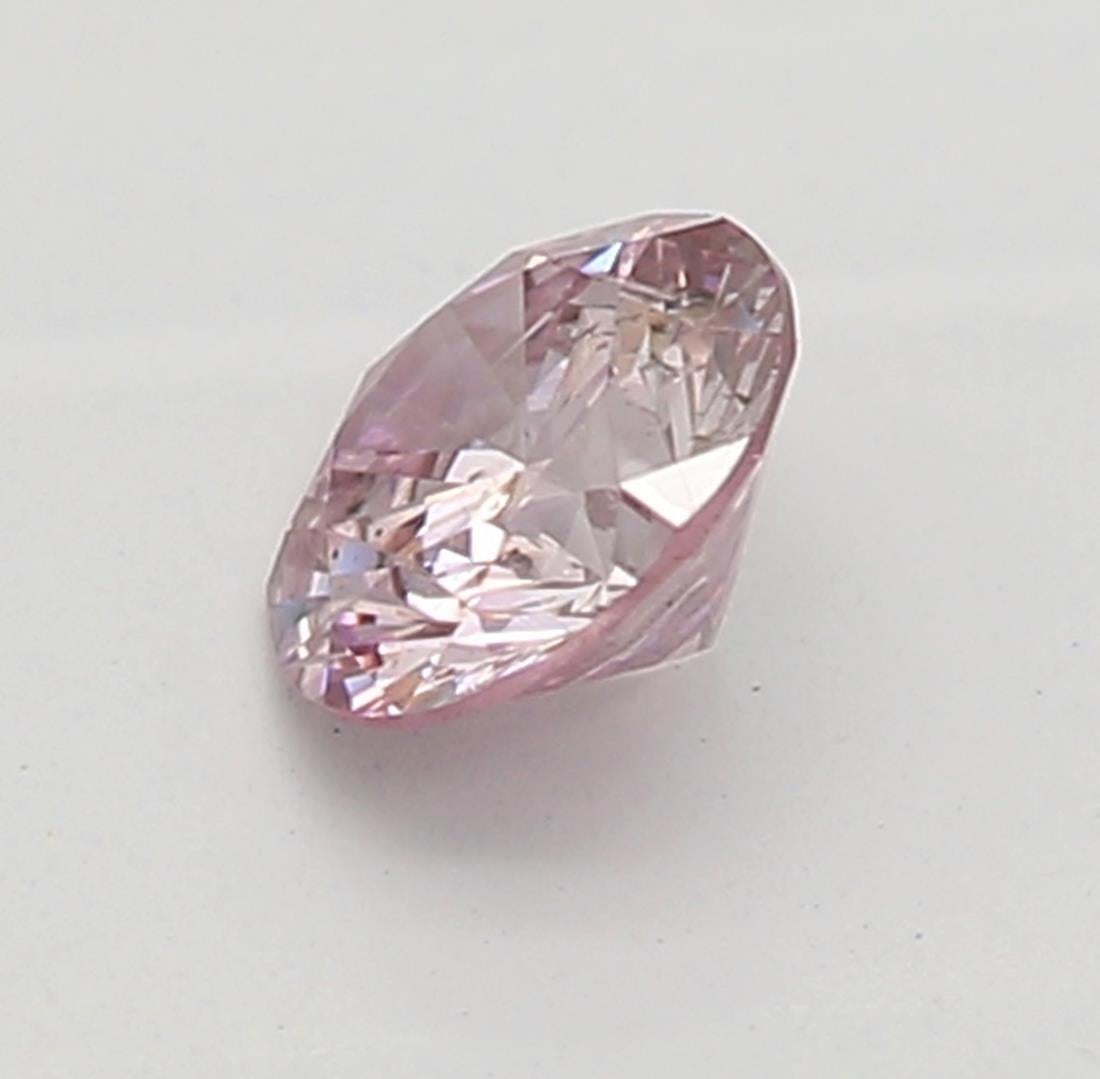 Round Cut GIA Certified 0.15 Carat Fancy Intense Purplish Pink I1 Clarity Diamond For Sale