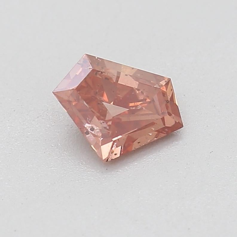Certificate: GIA 
Report Number: 6227832812
Shape And Cut: Shield
Carat Weight: 0.23 carat
Measurements: 3.84 x 5.19 x 1.80 mm
Color Grade: Fancy Deep Orangy Pink

FEATURES OF THE DIAMOND:

This Fancy Deep Orangy Pink diamond is a rare and