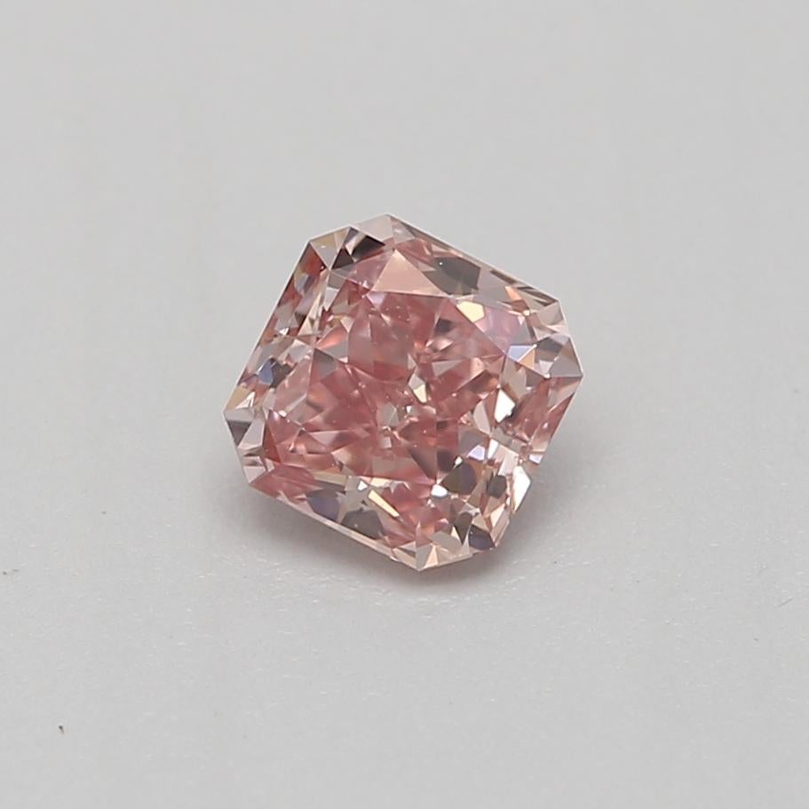Certificate: GIA 
Report Number:  2223874234
Shape And Cut: Radiant
Carat Weight: 0.23 carat
Measurements: 3.55 x 3.54 x 2.15 mm
Color Grade: Fancy Intense Pink

FEATURES OF THE DIAMOND:

This fancy intense pink diamond is a rare and captivating