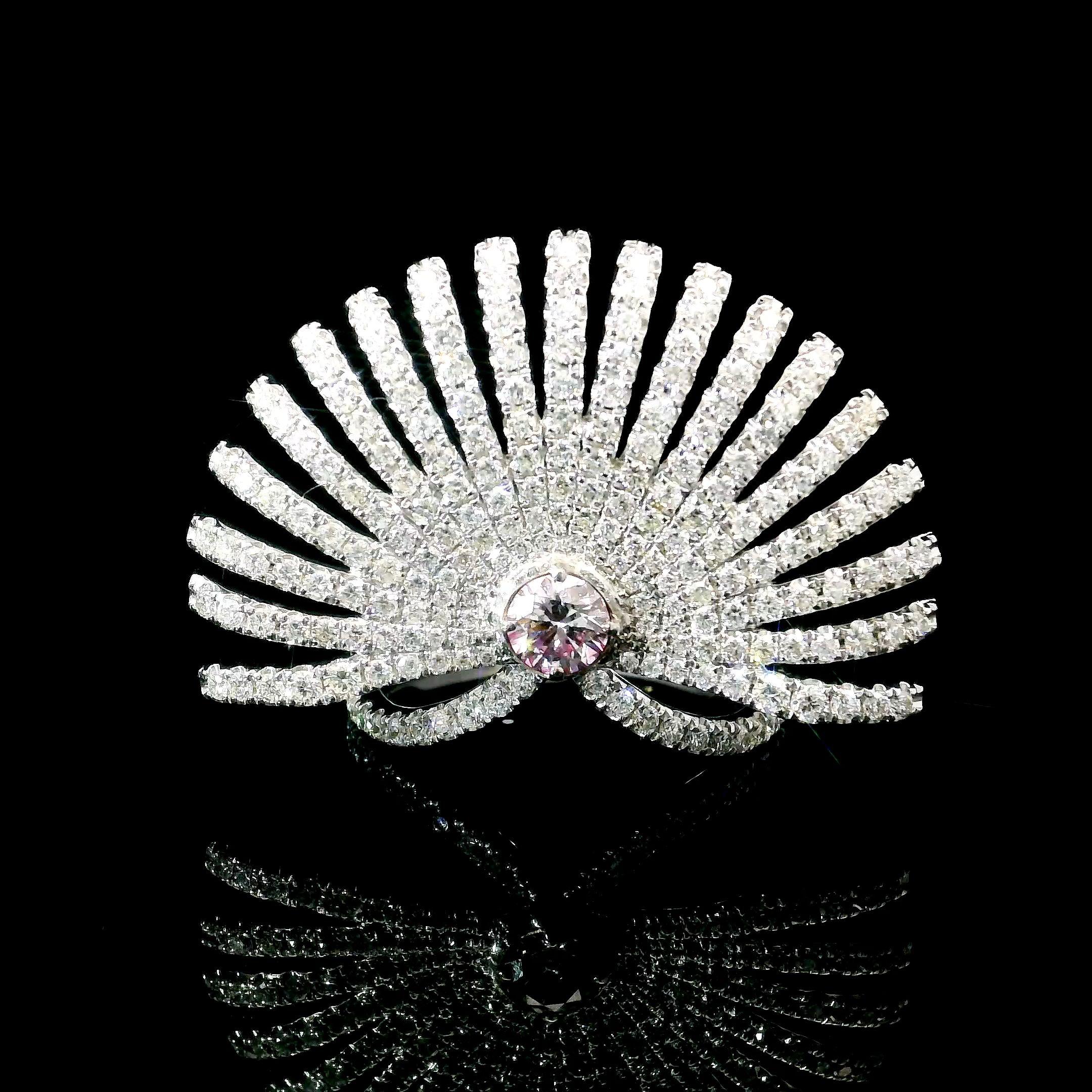 18kt white gold ring with diamonds
  
  Gold colour & karat: White gold 18kt
  Weight: 5.97 grams
  
  Set with-
  Stone type: Diamonds
  Shape: Round
  Carat: 0.26
  Colour: Faint Pink  
  Clarity: VS1
  
  Surrounding Stones: Diamonds
 1) White