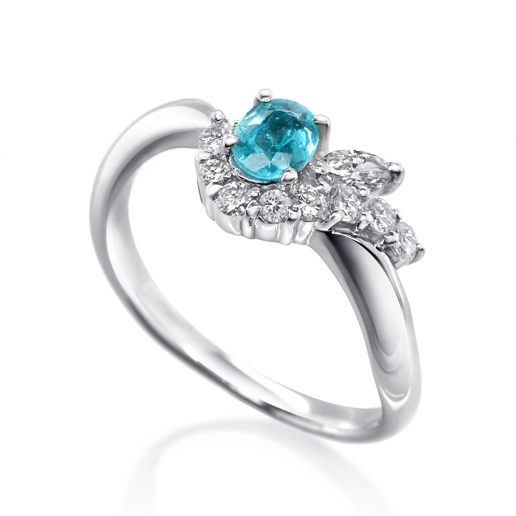 A beautiful ring featuring a GIA Certified 0.26 Carat Natural Brazilian Paraiba Tourmaline and 0.17 Carats of Diamond Accents set in Platinum. Paraiba Tourmalines were only discovered 30 years ago in the Brazilian state of the same name- Paraiba.