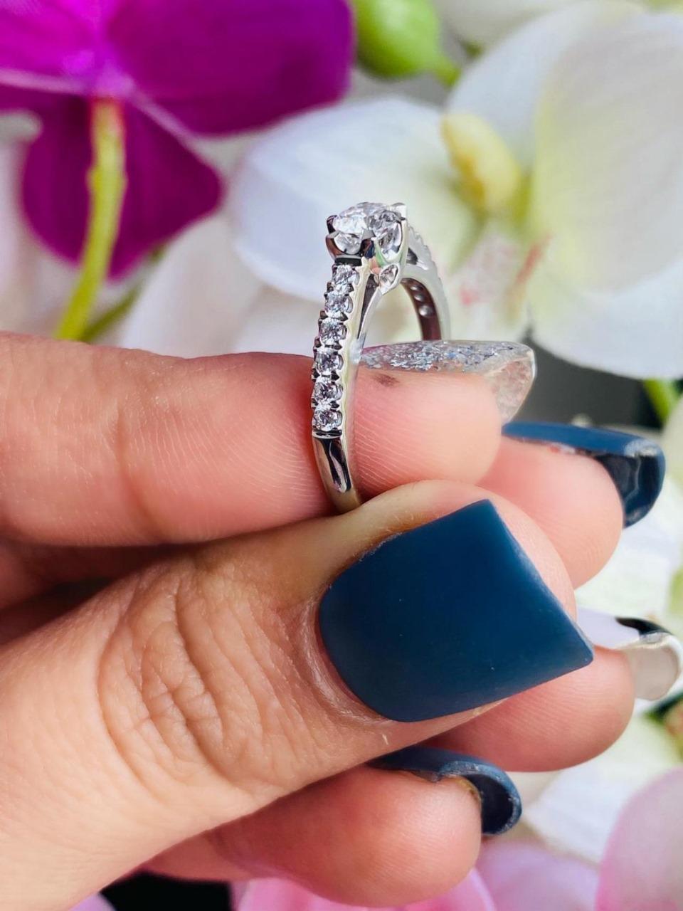 18kt white gold ring with diamonds
  
  Gold colour & karat: White gold 18kt
  Weight: 2.96 grams
  
  Set with-
  Stone type: Diamonds
  Shape: Round
  Carat: 0.30
  Colour: D 
  Clarity: IF
  
  Surrounding Stones: Diamonds
 1) White Diamonds
 