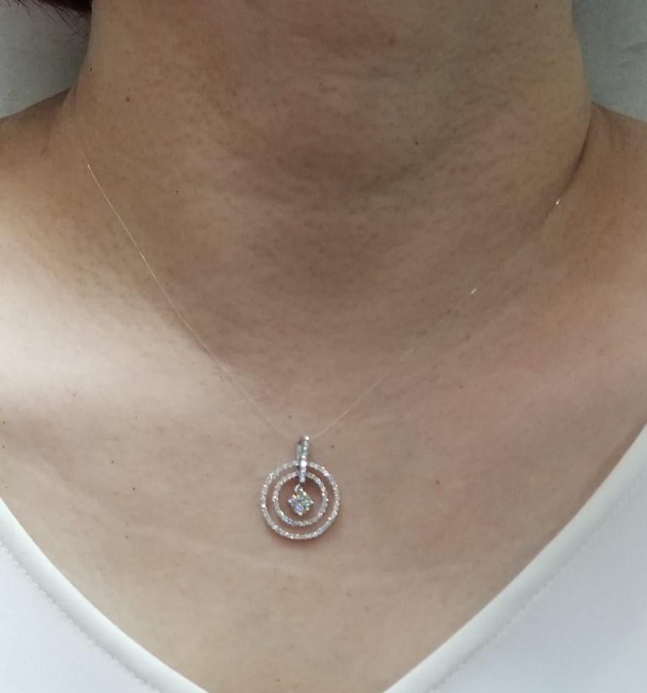 This pendant features a GIA certified diamond at the center ( H VS2 0.30 carat), there are 2 diamond halo surrounding the center stone. Pendant is set in 18 karat white gold. Total carat weight of 0.77 carat.

1 Diamond 0.30 carat
White round