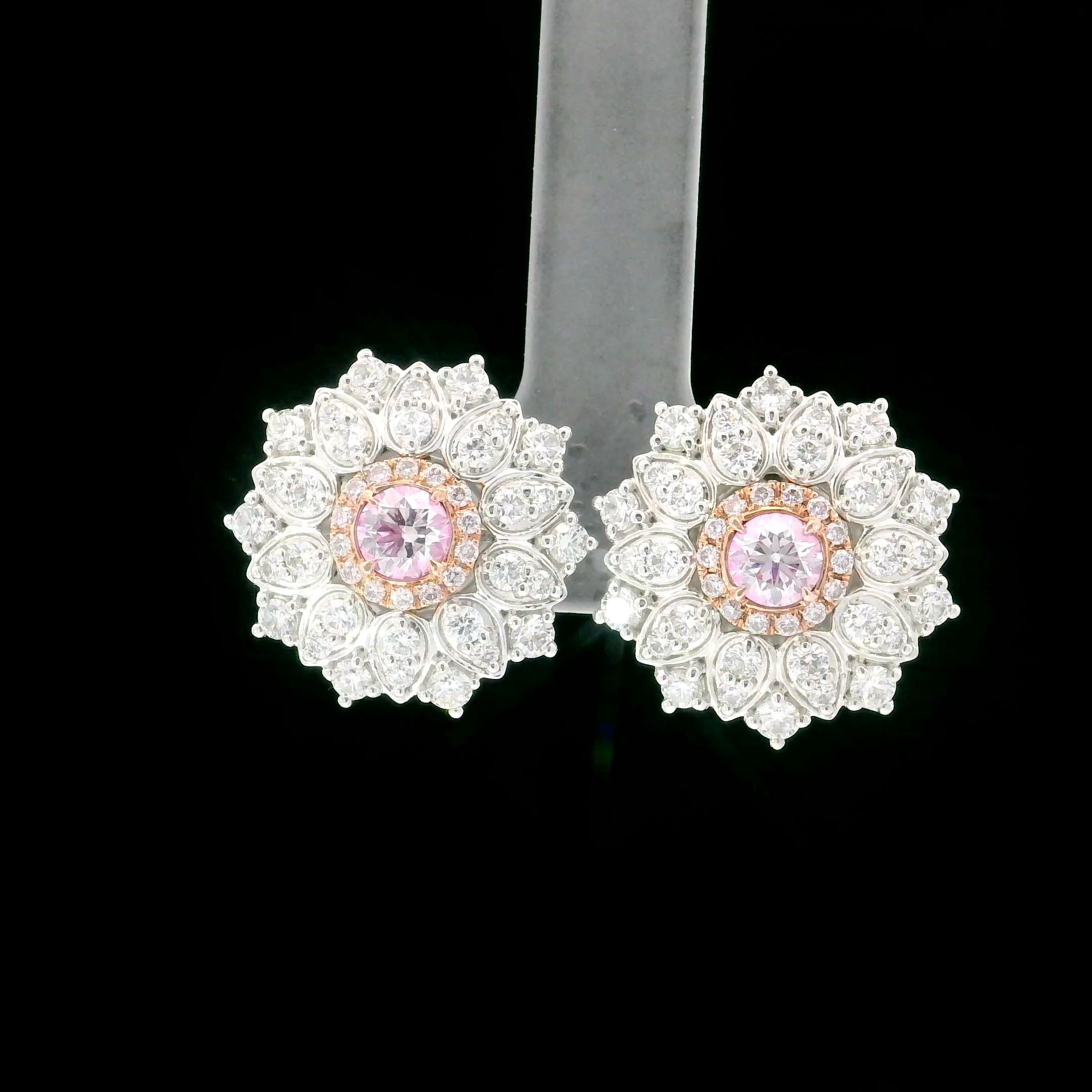 18kt white gold earring with diamonds
  
  Gold colour & karat: White gold 18kt
  Weight: 8.529 grams
  
  Set with-
  Stone type: Diamonds
  Shape: Round 
  Carat: 0.30
  Colour: Faint Pink
  Clarity: VS1

  Stone type: Diamonds
  Shape: Round
 