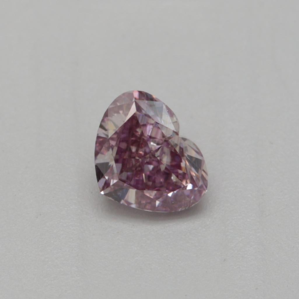 Certificate: GIA
Report Number: 6451111120
Shape And Cut: Heart
Carat Weight: 0.30 carat
Measurements: 3.75 x 4.68 x 2.41 mm
Color Grade: Fancy Brownish Purple Pink

Our fancy brownish purple-pink diamond is a unique and rare diamond with a