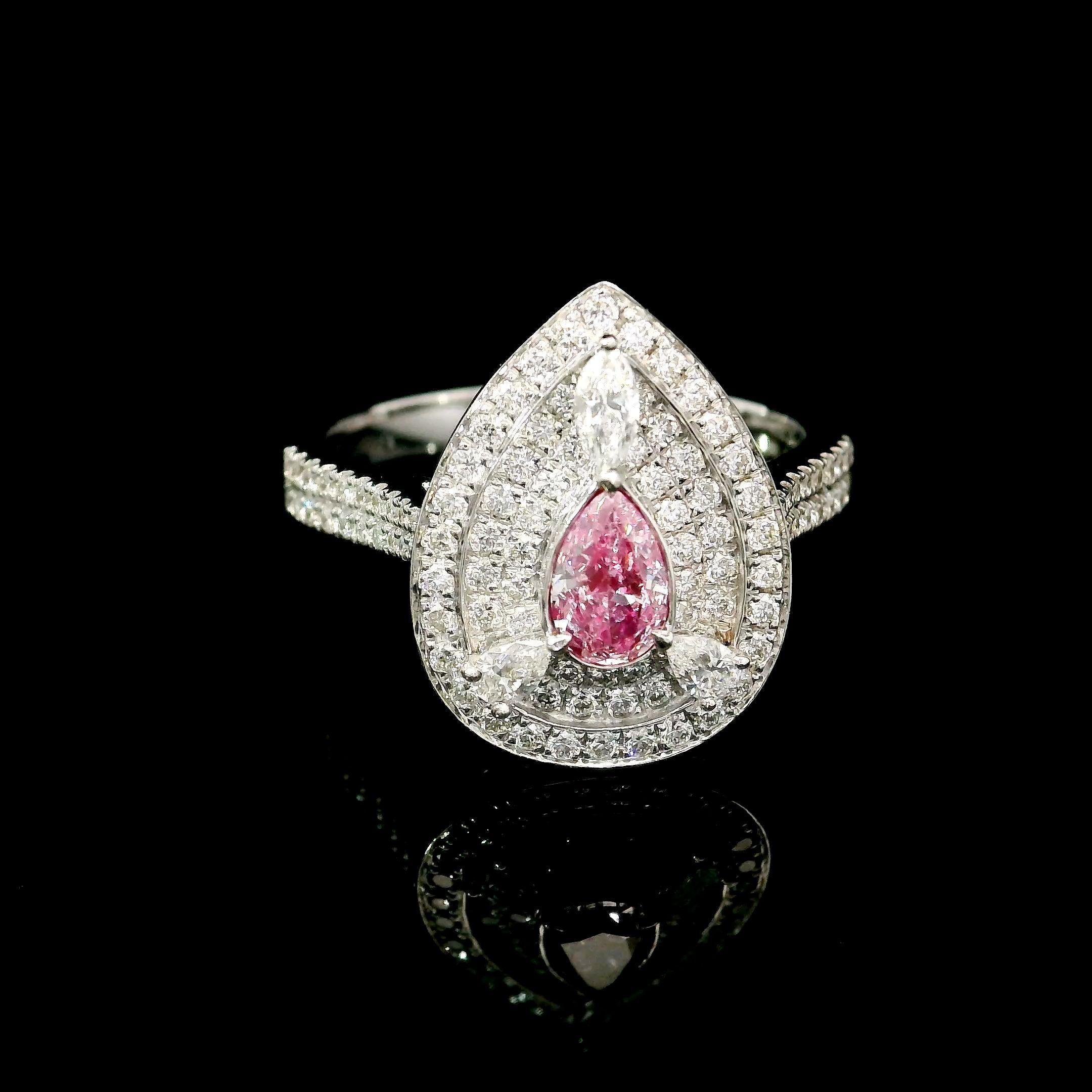 18kt white gold ring with diamonds
  
  Gold colour & karat: White gold 18kt
  Weight: 4.54 grams
  
  Set with-
  Stone type: Diamonds
  Shape: Pear
  Carat: 0.31
  Colour: Faint Pink  
  Clarity: SI2
  
  Surrounding Stones: Diamonds
 1) White