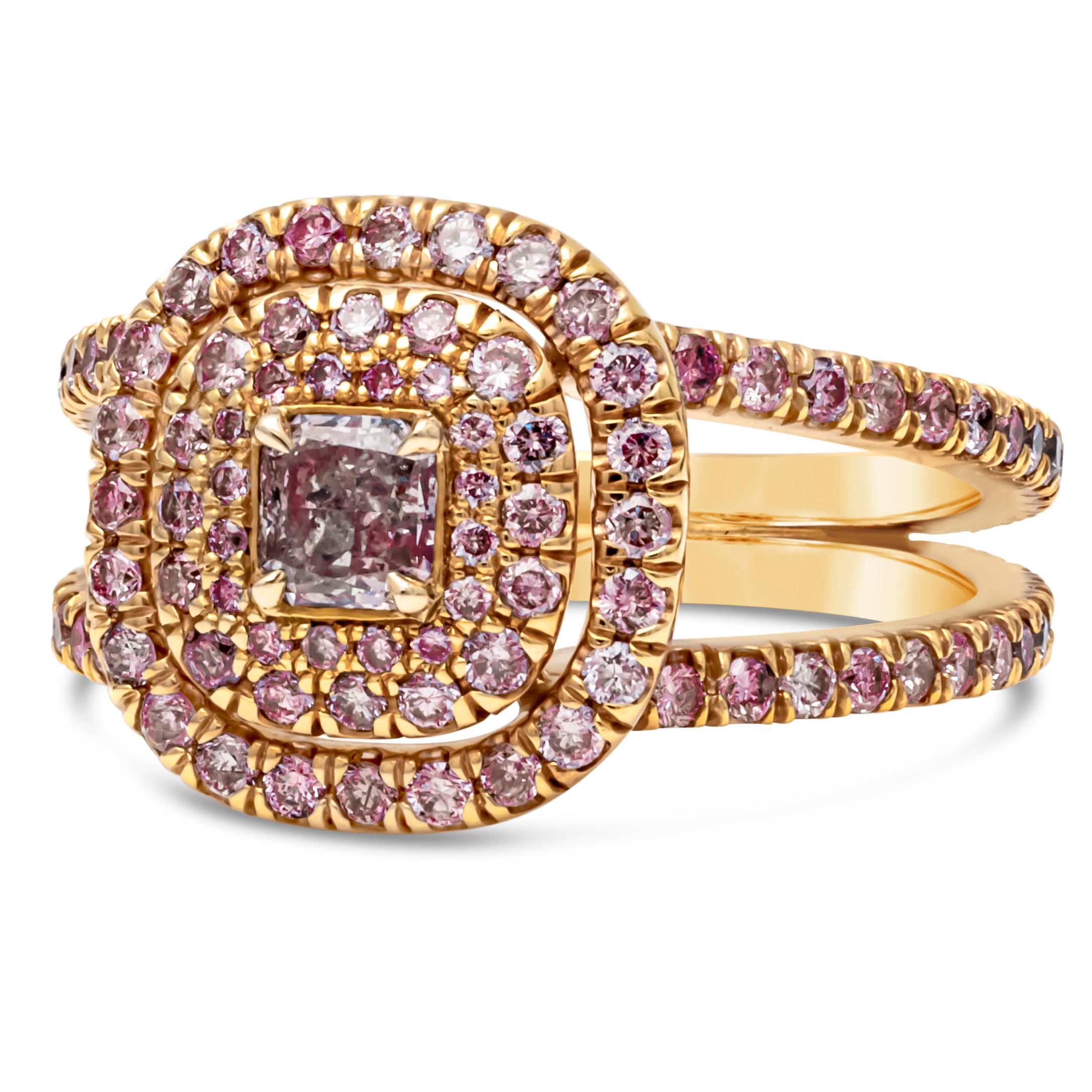 A unique engagement ring style showcasing a 0.31 carats radiant cut diamond certified by GIA as Fancy Light Purplish Pink color. Surrounded by three-row of brilliant round pink diamonds in a triple halo design and set in a diamond encrusted