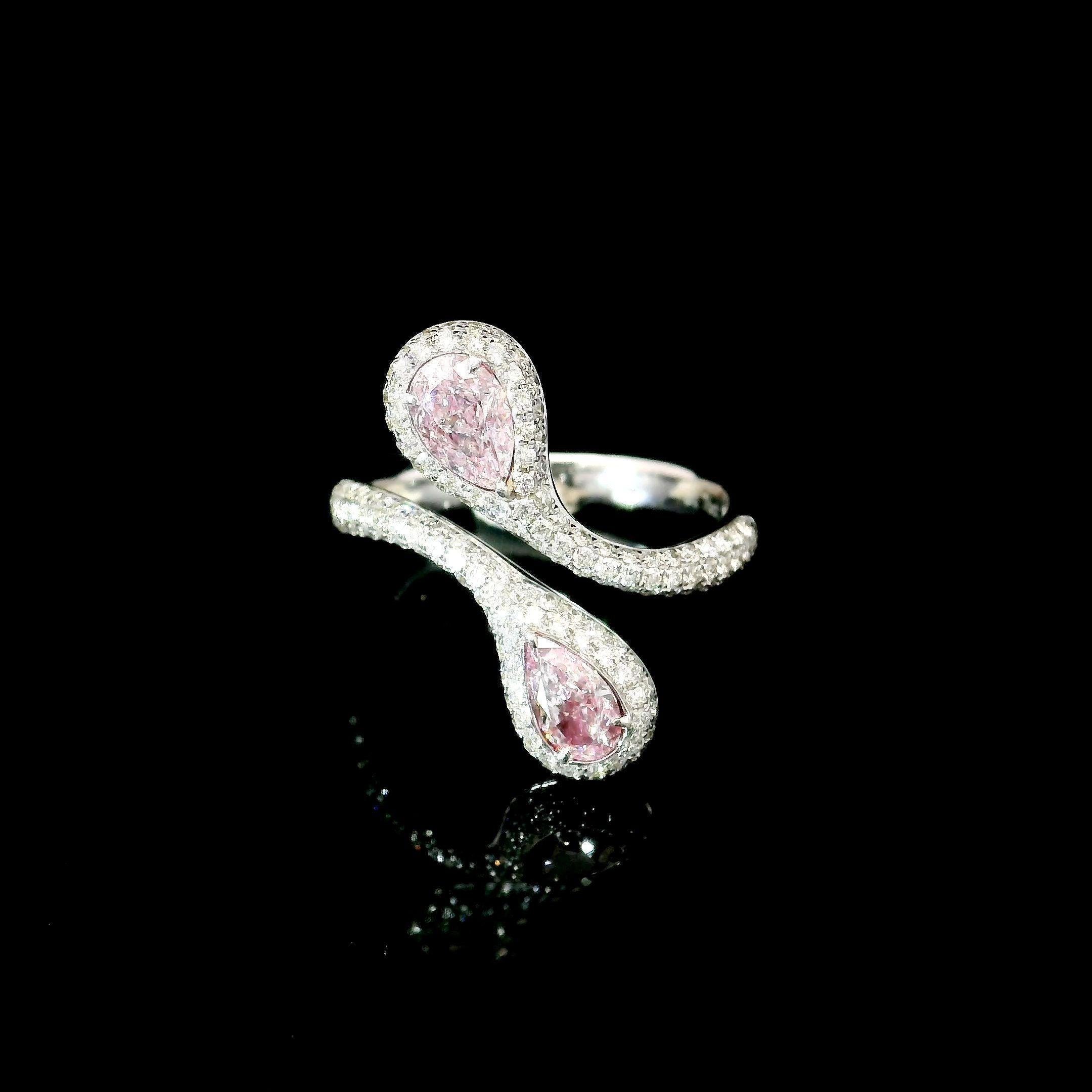 18kt white gold ring with diamonds
  
  Gold colour & karat: White gold 18kt
  Weight: 5.17 grams
  
  Set with-
  Stone type: Diamonds
  Shape: Pear / Pear
  Carat: 0.34 / 0.42 ct
  Colour: Faint Pink / Faint Pink
  Clarity: VS2 / SI2
  
 