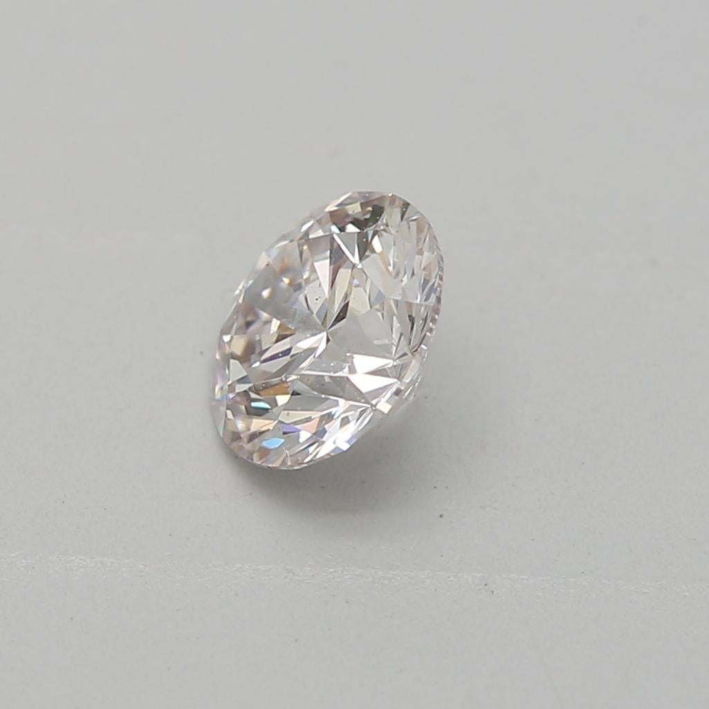 Certificate: GIA
Report Number: 7402786900
Shape And Cut: Round
Carat Weight: 0.35 carat
Measurements: C4.50 - 4.54 x 2.84 mm
Color Grade: Faint Pink

This faint pink diamond is a natural diamond with a subtle, delicate pink hue. The color is light