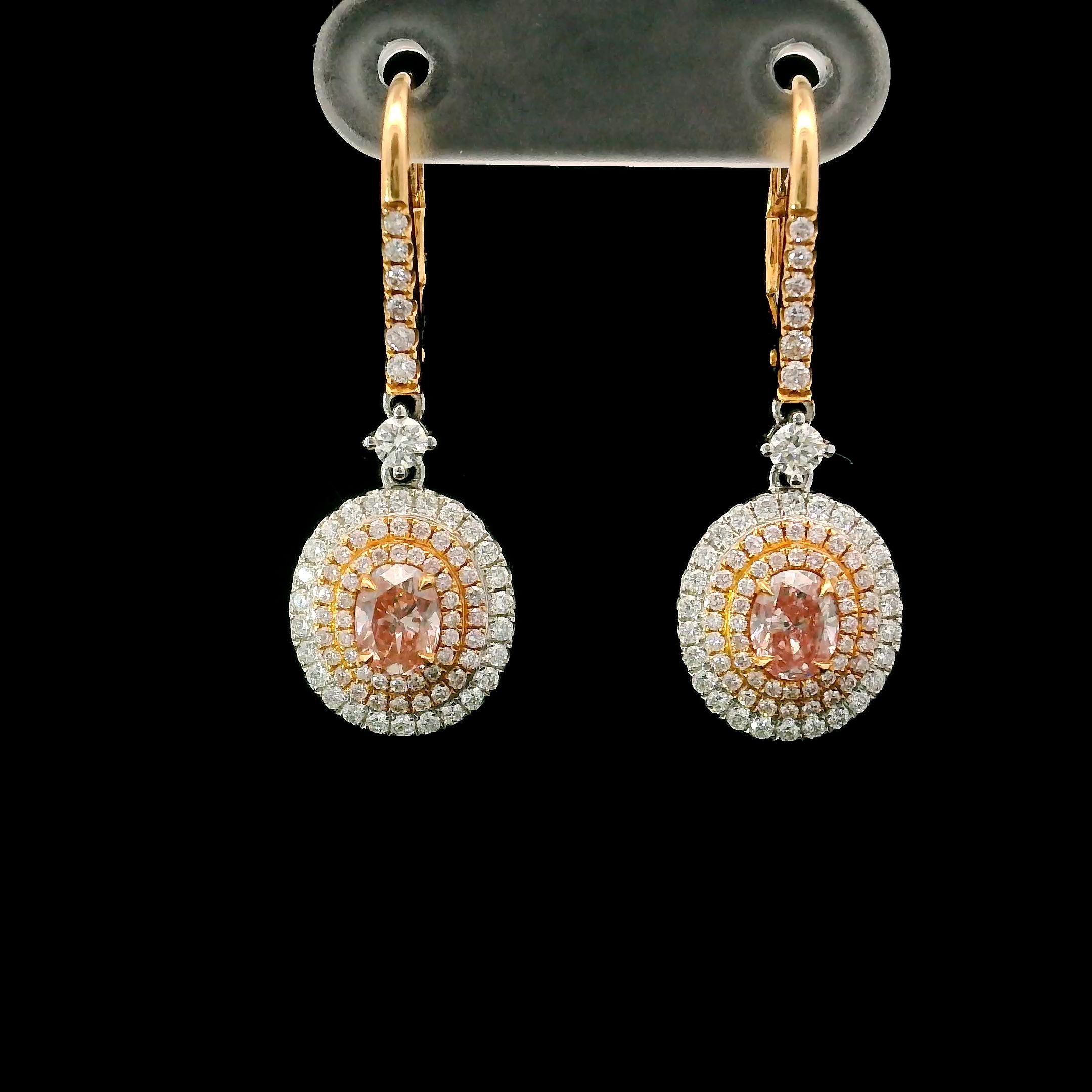 18kt white gold earring with diamonds
  
  Gold colour & karat: White gold 18kt
  Weight: 4.60 grams
  
  Set with-
  Stone type: Diamonds
  Shape: Oval
  Carat: 0.37
  Colour: Fancy Orangy Pink
  Clarity: SI1

  Stone type: Diamonds
  Shape: Oval
 