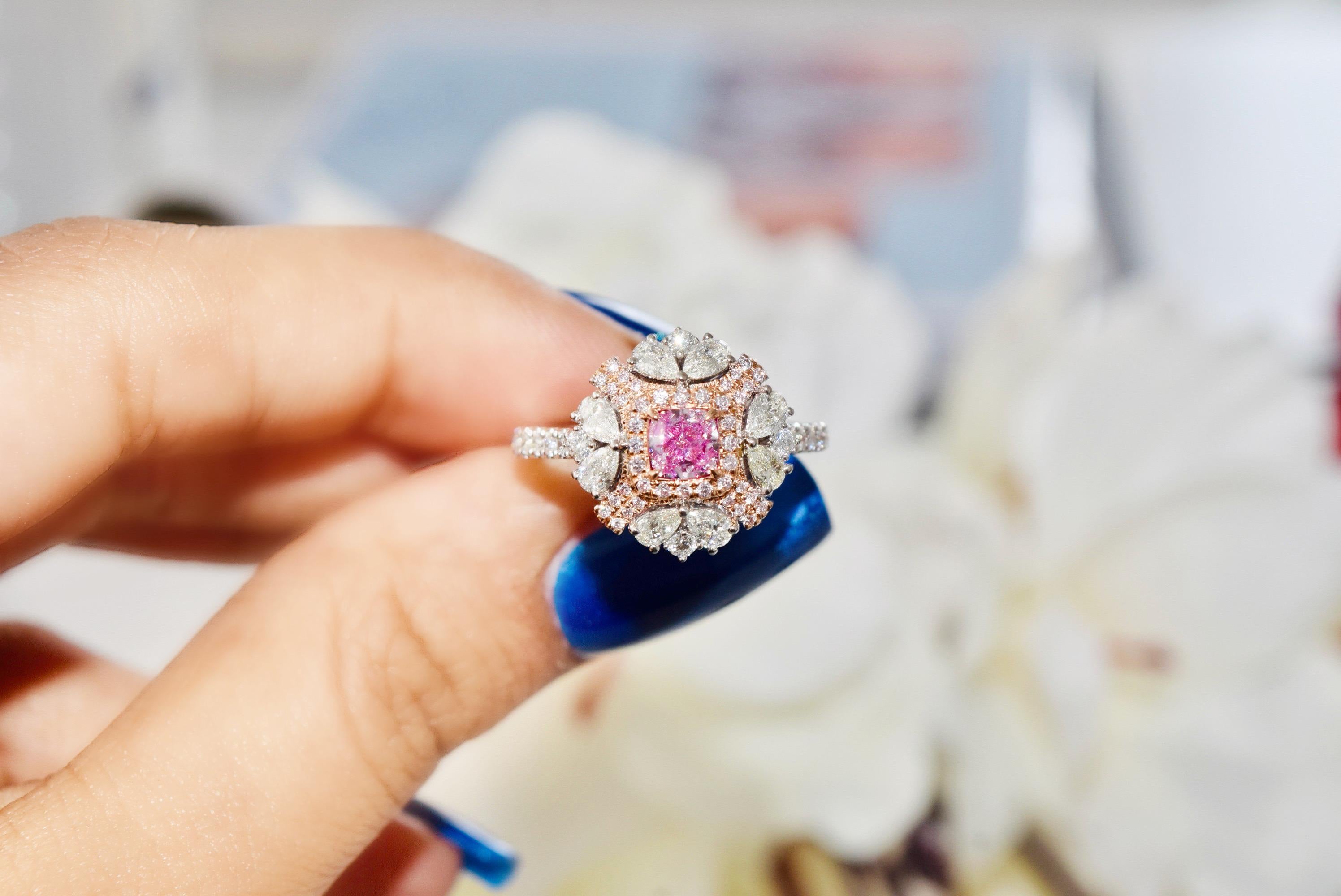 18kt white gold ring with diamonds
  
  Gold colour & karat: White gold 18kt
  Weight: 4.196 grams
  
  Set with-
  Stone type: Diamonds
  Shape: Cushion
  Carat: 0.40
  Colour: Faint Pink  
  Clarity: SI1
  
  Surrounding Stones: Diamonds
 1) White