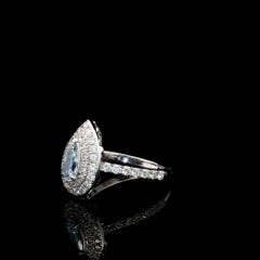 Bague sertie d'un diamant certifié par le GIA de 0,43 carat, de couleur bleu-vert clair fantaisie, pureté VS2