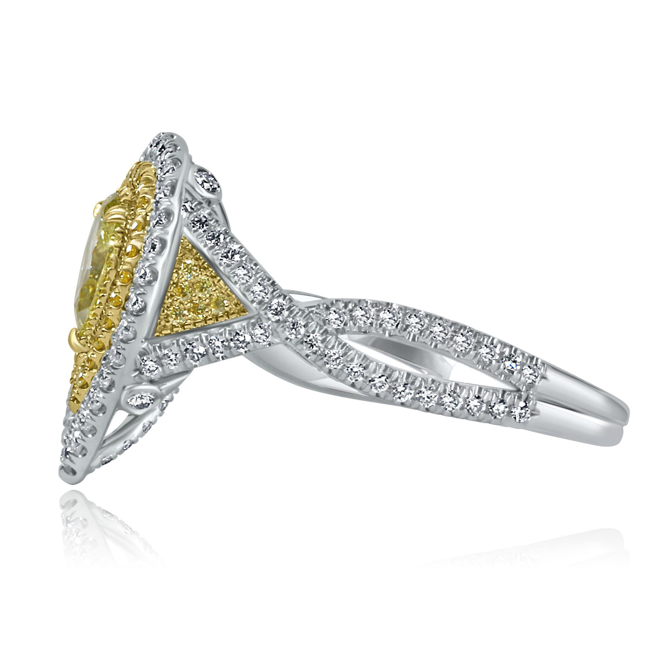 This engagement ring is a dazzling symphony of yellow and colorless diamonds, set in delicate 18k two-tone gold. The centerpiece is a 0.45-carat GIA-certified natural fancy intense yellow pear brilliant diamond with SI2 clarity, its fiery color