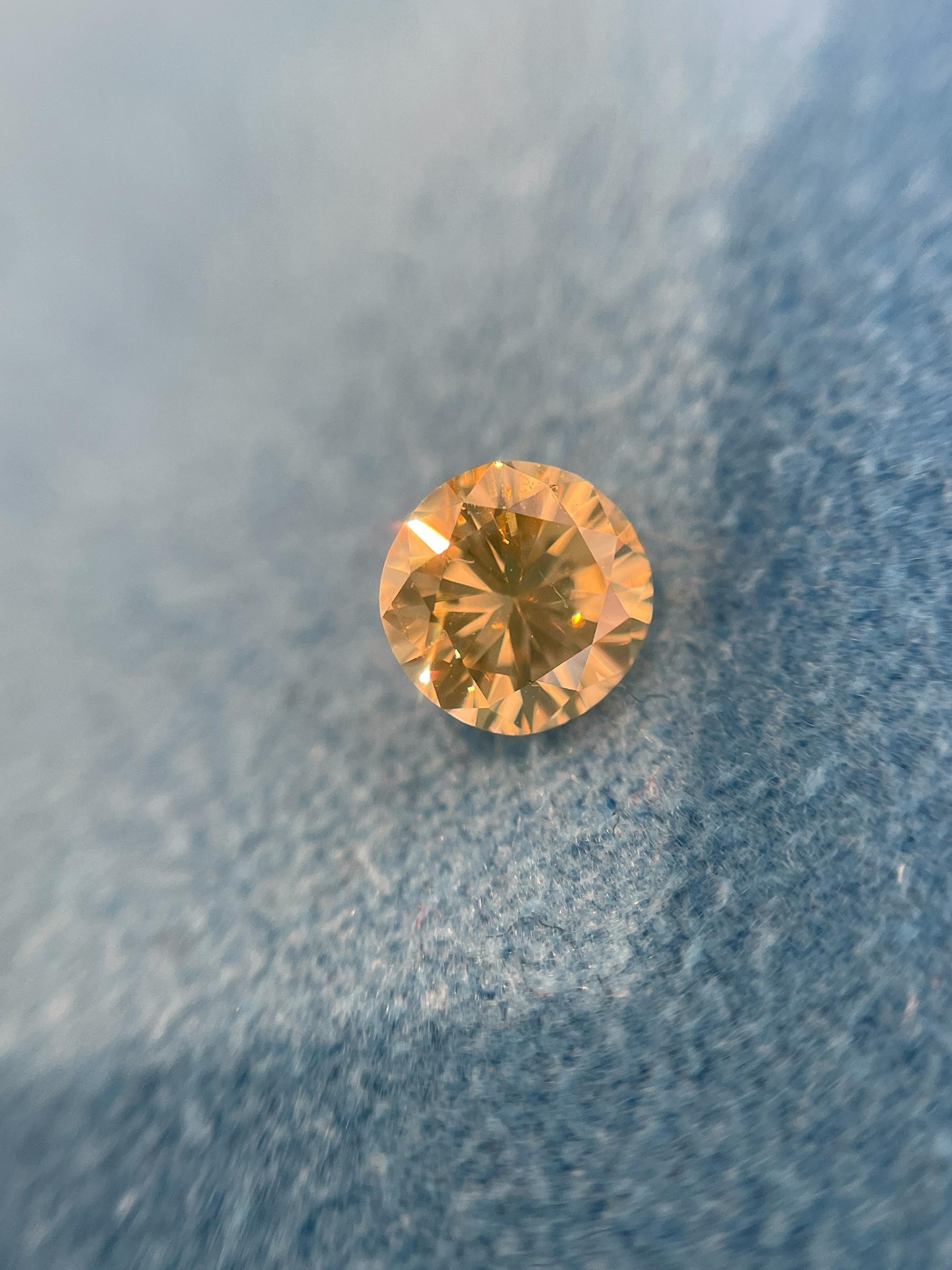 ITEM DESCRIPTION

ID #: NYC58500
Stone Shape: Round
Diamond Weight: 0.45ctw
Fancy Color: Fancy Yellow
Cut: Brilliant
Measurements: 4.54 - 4.65 x 3.16 mm
Symmetry: Good
Polish: Good
Fluorescence: None
Certifying Lab: GIA
GIA Certificate #: