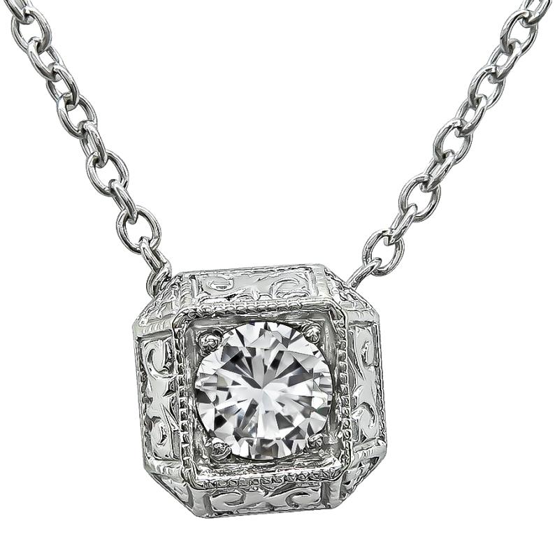 This charming 14k white gold pendant necklace is set with sparkling GIA certified round brilliant cut diamond that weighs 0.48ct. graded H color with VS2 clarity. The pendant measures 9mm by 9mm and the chain measures 17 1/2 inches in length.
It is