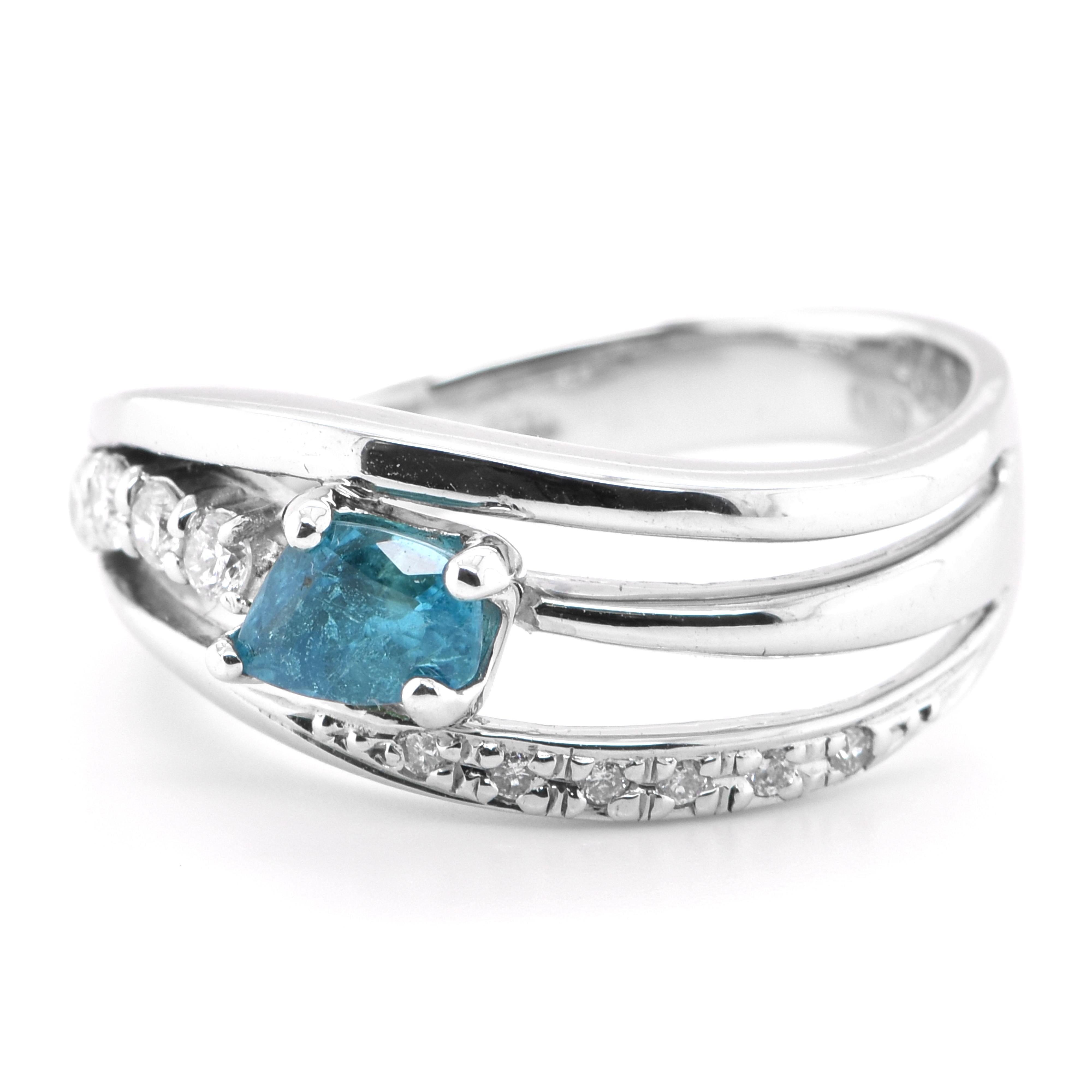 A beautiful Cocktail Ring featuring a GIA Certified 0.48 Carat Natural Brazilian Paraiba Tourmaline and 0.20 Carats of Diamond Accents set in Platinum. Paraiba Tourmalines were only discovered 30 years ago in the Brazilian state of the same name-