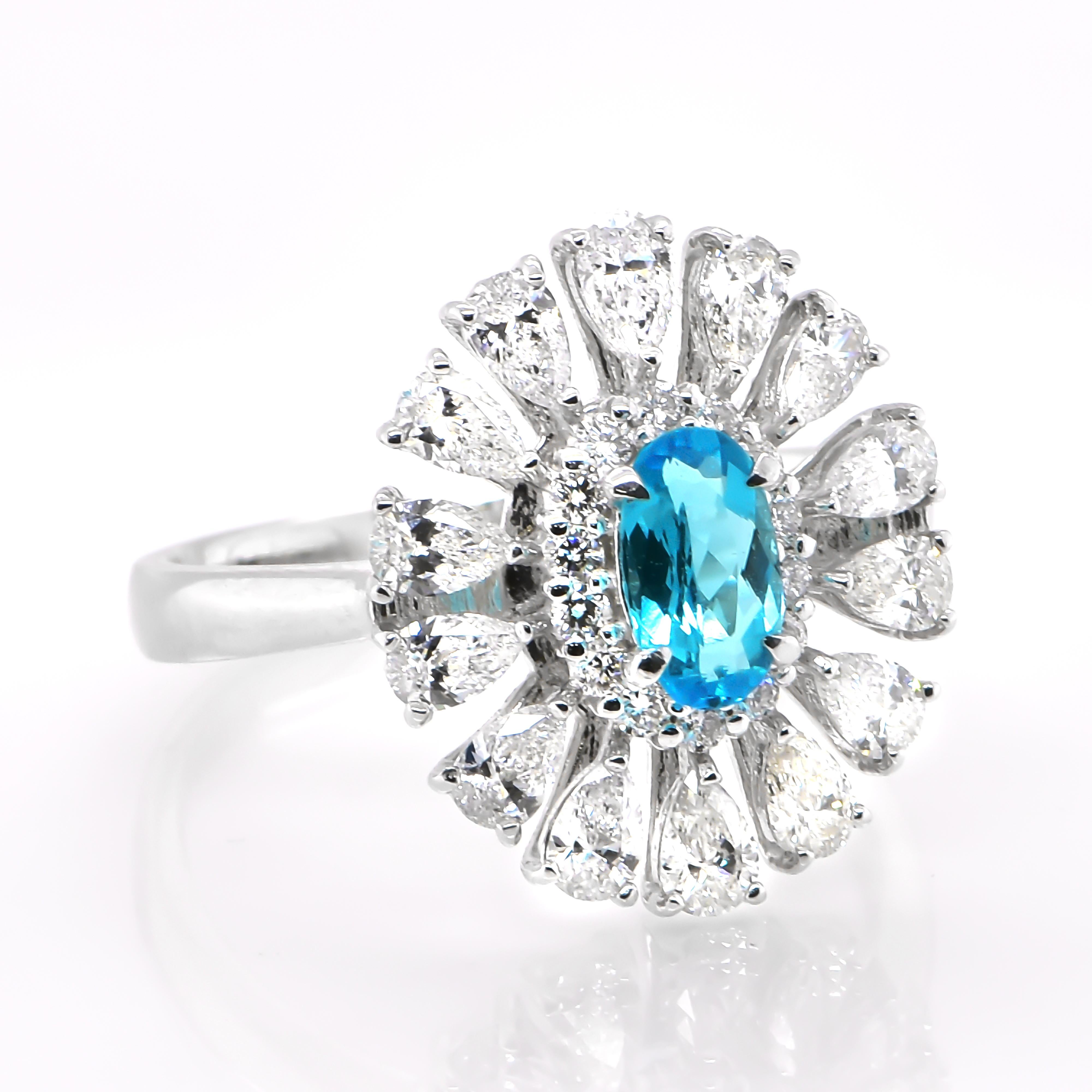 A beautiful ring featuring a GIA Certified 0.49 Carat Natural Brazilian Paraiba Tourmaline and 1.16 Carats of Diamond Accents set in Platinum. Paraiba Tourmalines were only discovered 30 years ago in the Brazilian state of the same name- Paraiba.