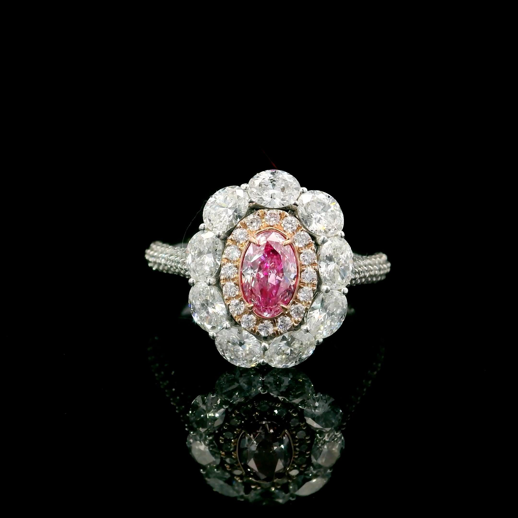 18kt white gold ring with diamonds
  
  Gold colour & karat: White gold 18kt
  Weight: 4.177 grams
  
  Set with-
  Stone type: Diamonds
  Shape: Oval
  Carat: 0.50
  Colour: Very Light Pink
  Clarity: SI2
  
  Surrounding Stones: Diamonds
 1) Side