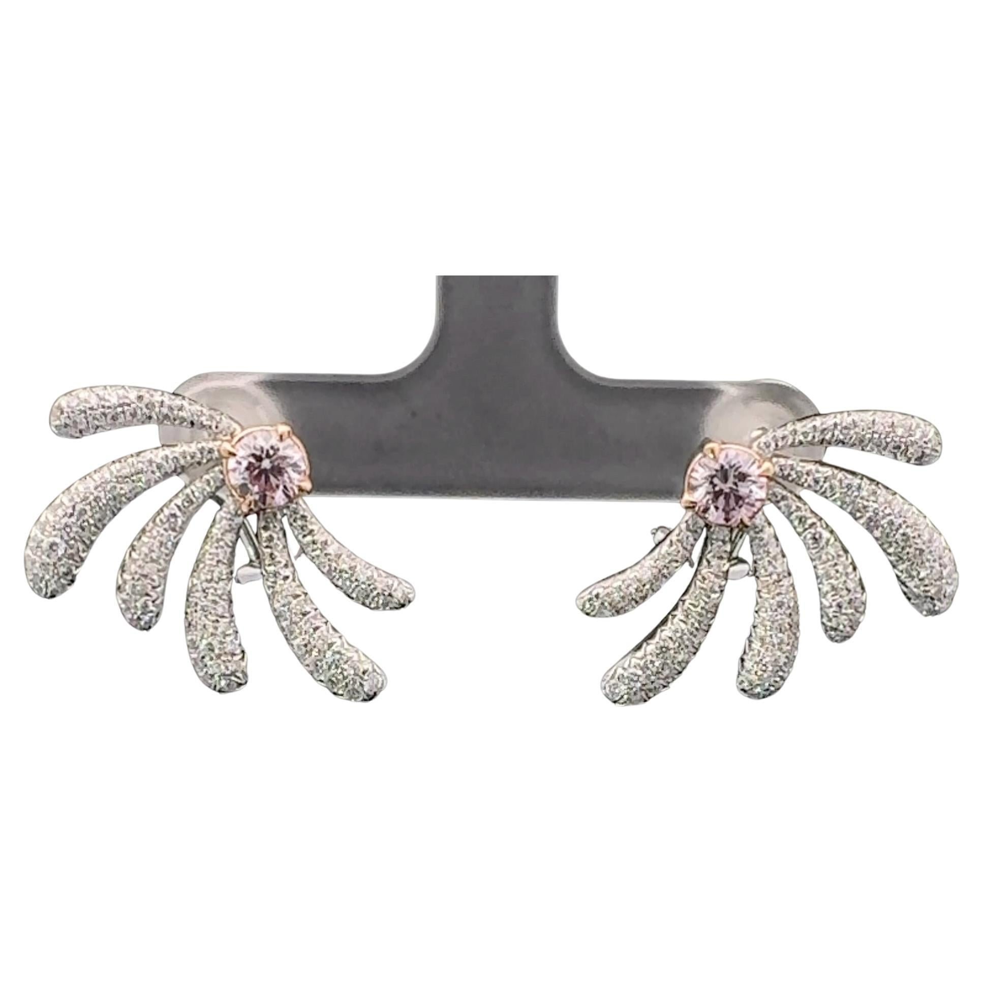 18kt white gold earring with diamonds
  
  Gold colour & karat: White gold 18kt
  Weight: 11.32 grams
  
  Set with-
  Stone type: Diamonds
  Shape: Round
  Carat: 0.50
  Colour: Faint Pink
  Clarity: SI1

  Stone type: Diamonds
  Shape: Round
 