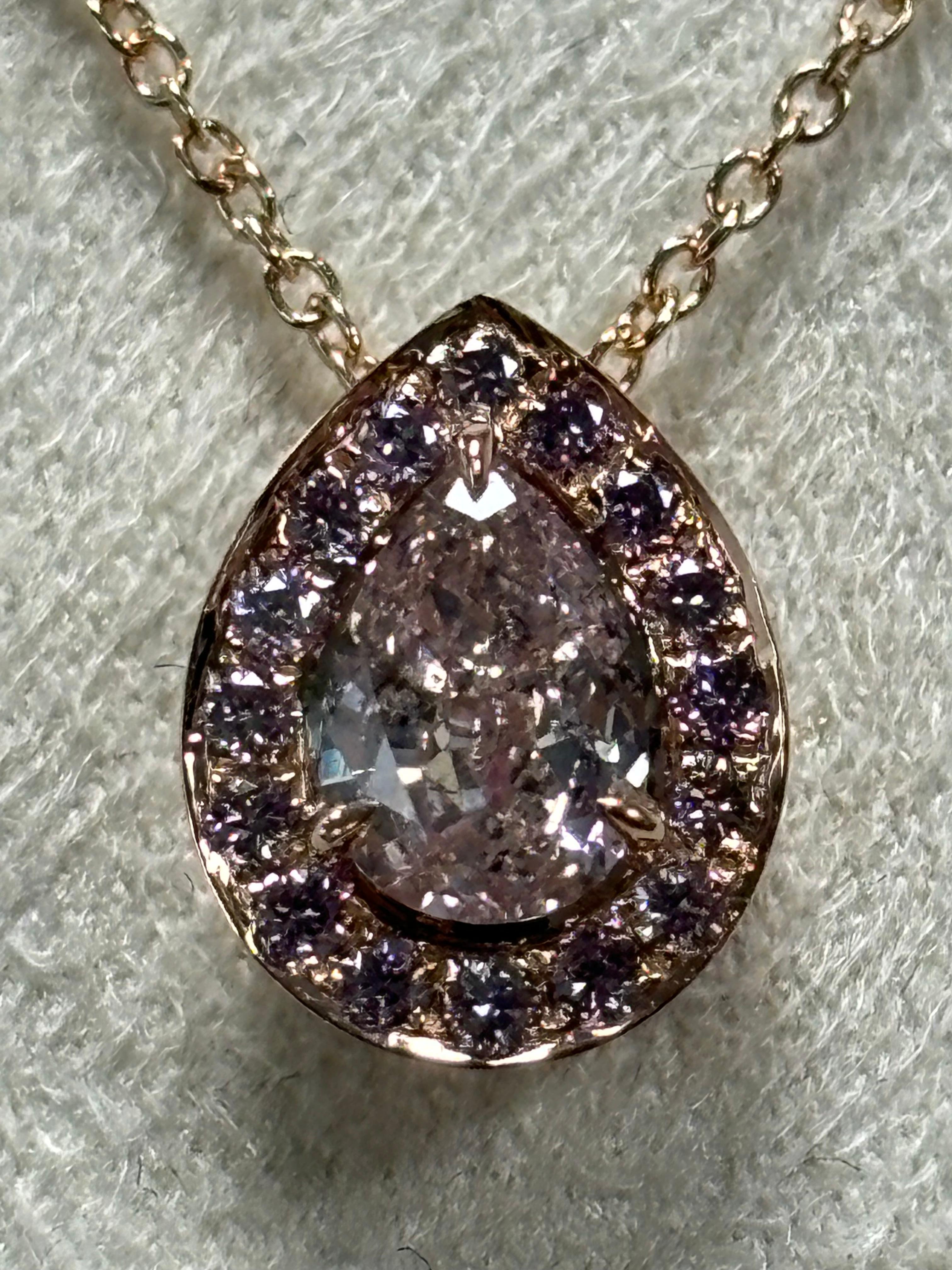 We are natural diamond production company located in Dubai.
This stunning natural 0.50  ct Pera Shape Fancy Brown-Pink diamond pendant necklace is crafted in 18k Rose Gold surrounding and set in chain with Fancy Intense Pink Round Shape diamonds (25