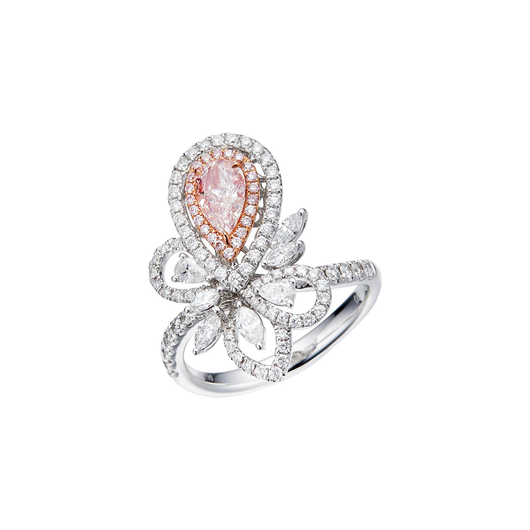 Prepare to be entranced by a symphony of colors and shapes – the GIA Certified 0.50 carat Natural Faint Pinkish Brown Pear Shape Diamond Solitaire Ring. This exquisite piece, set upon a resplendent 18kt gold band, is a true masterpiece that captures