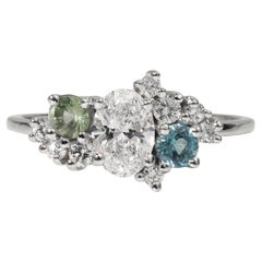 Anello con cluster di diamanti ovali certificati GIA da 0,50 carati con accenti di gemme colorate in oro
