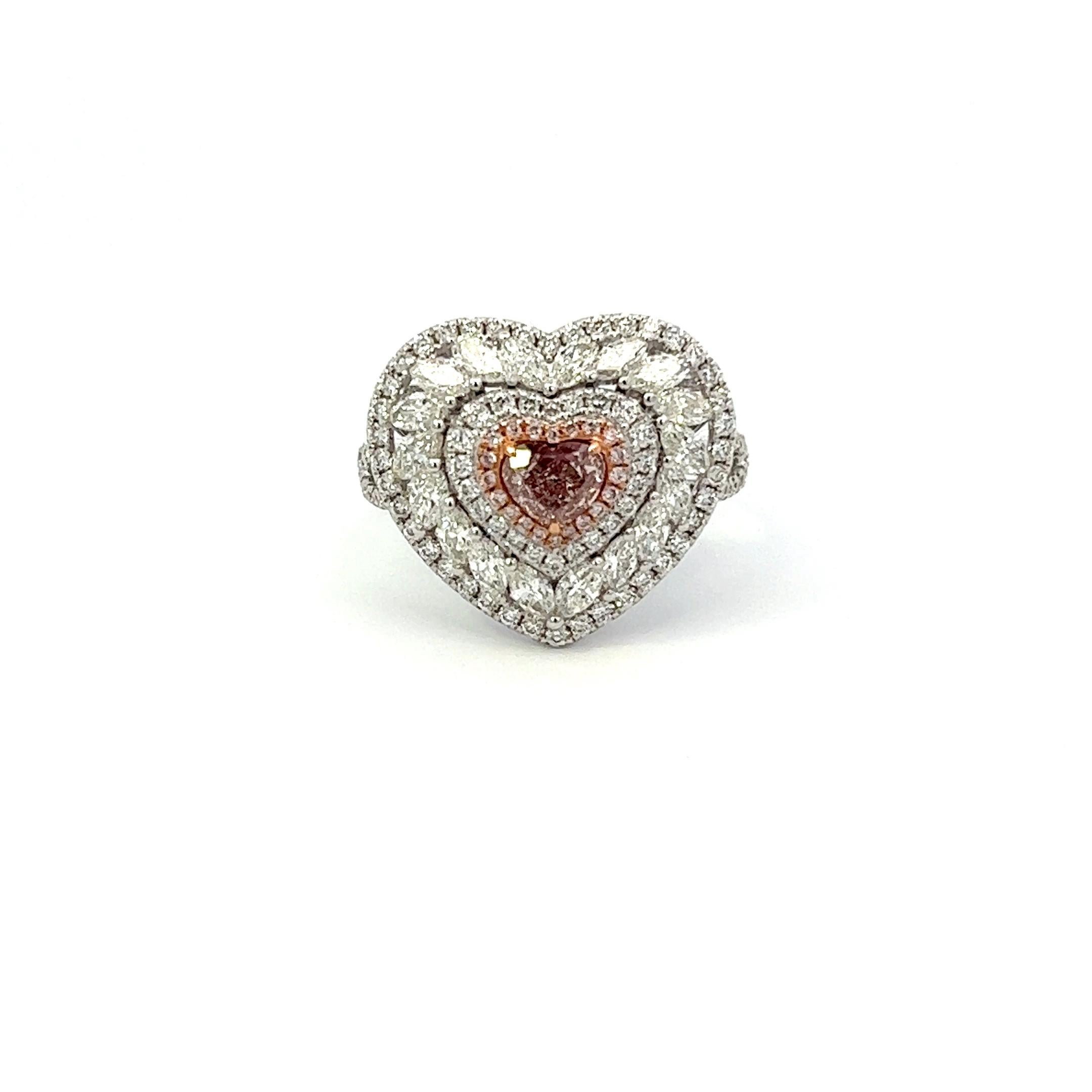 Center: 0.50ct Fancy Light Pinkish Brown Heart VS2 GIA# 2404855672
Setting: 18k White Gold 1.48ctw Pink and White Diamonds

An extremely rare and stunning natural pink diamond center. Pink Diamonds account for less than 0.01% of all diamonds mined