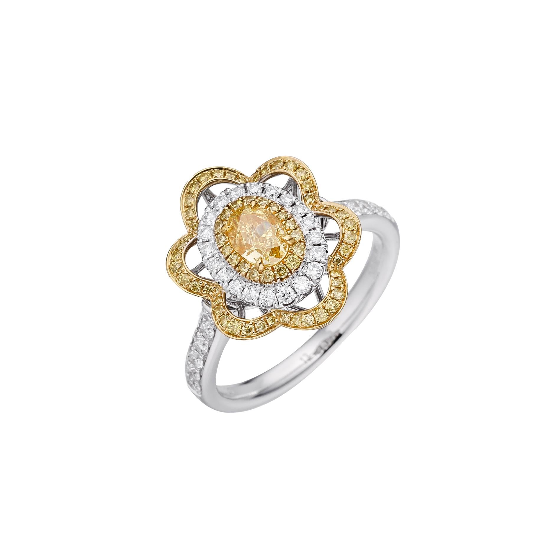 Erleben Sie den Inbegriff von Eleganz mit diesem exquisiten Schmuckstück mit einem GIA-zertifizierten, ovalen, intensiv gelben Naturdiamanten von 0,50 Karat, gefasst in einem glänzenden 18-karätigen Goldband. Der gelbe Diamant in der Mitte ist ein