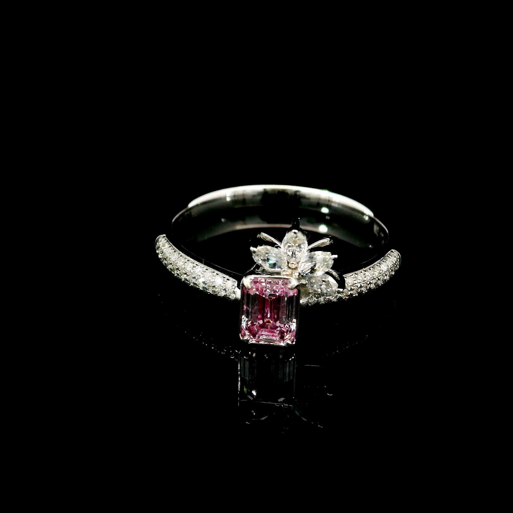 18kt white gold ring with diamonds
  
  Gold colour & karat: White gold 18kt
  Weight: 3.03 grams
  
  Set with-
  Stone type: Diamonds
  Shape: Emerald
  Carat: 0.51 ct
  Colour: Faint Pink
  Clarity: SI1
  
  Surrounding Stones: Diamonds
 1) White