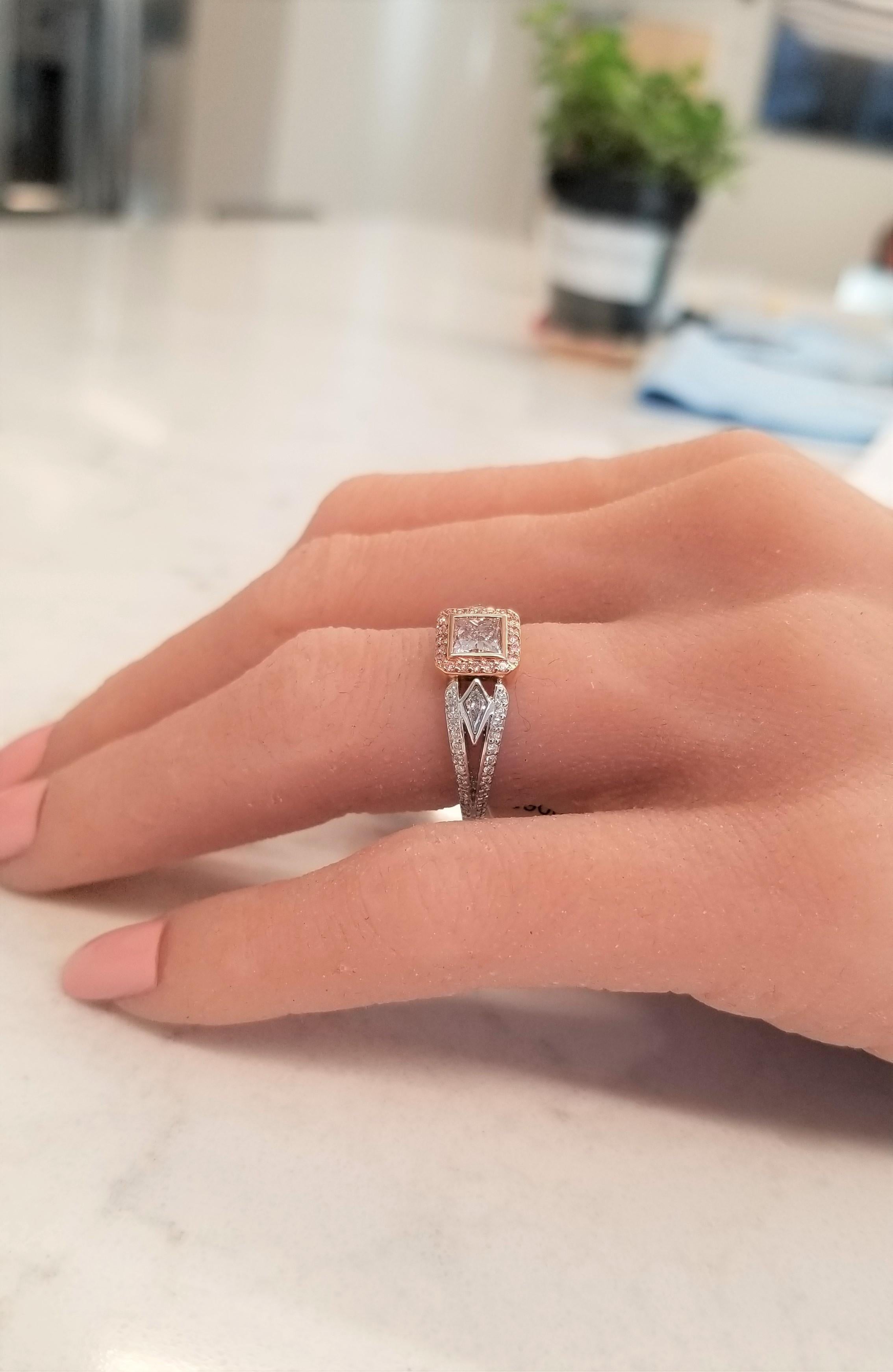 There is just one word that will slip from your lips when you lay your eyes upon this piece, “WOW!” This ring is crafted with enduring platinum and 18-Karat Rose gold, features a Beautiful Fancy-light Brown-Pink Princess cut diamond center born in