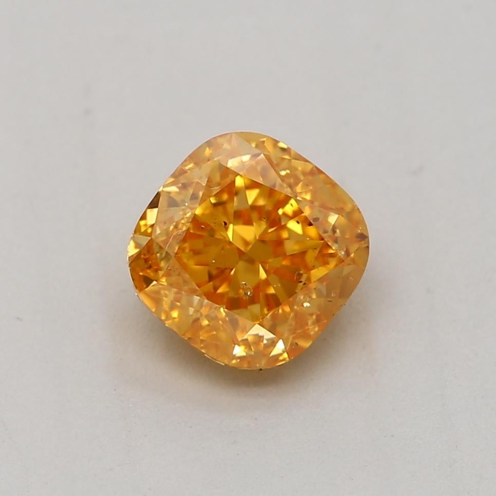 Certificate: GIA 
Report Number: 7356892891
Shape And Cut: Cushion
Carat Weight: 0.51 carat
Measurements: 4.36 x 4.32 x 3.01 mm
Color Grade: Fancy Vivid Yellow Orange

FEATURES OF THE DIAMOND:

This Fancy Vivid Yellow Orange diamond is a rare and