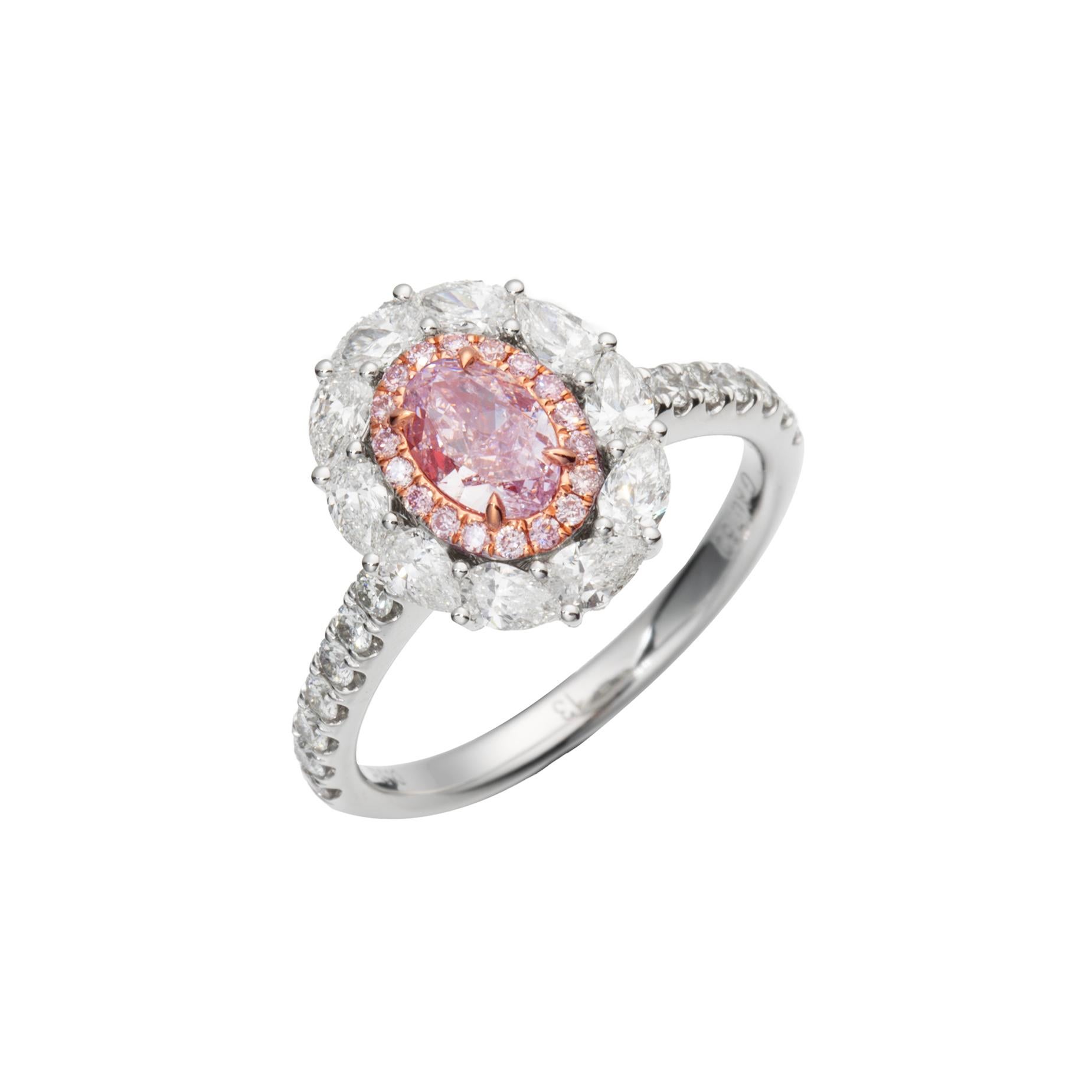 Introducing the epitome of elegance and rare beauty: the GIA Certified 0.51ct Natural Fancy Light Purplish Pink Oval Shape Diamond Ring on 18kt Gold. This exquisite piece is a testament to timeless luxury, meticulously crafted to capture hearts and